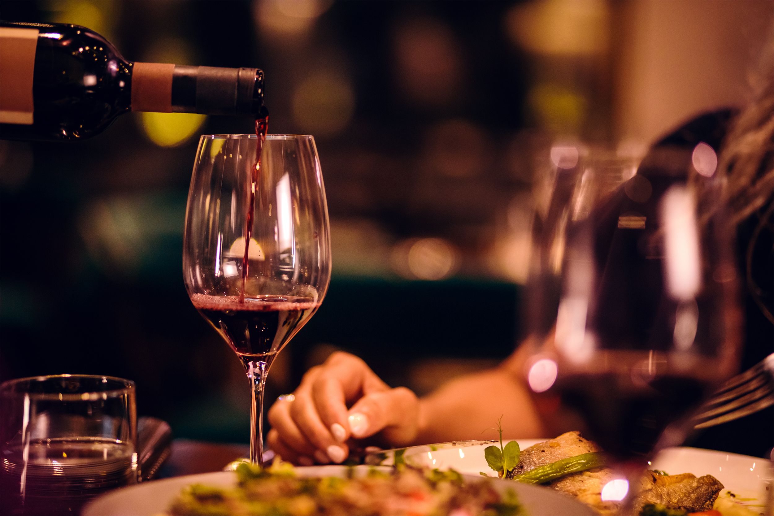 Pouring wine at restaurant