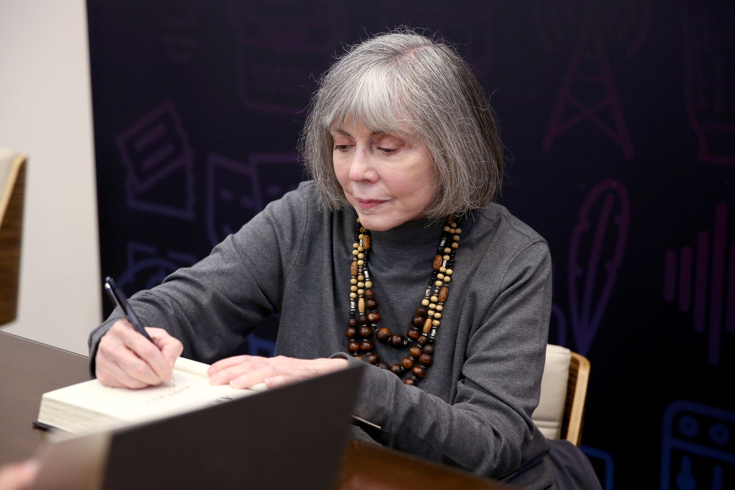 Author Anne Rice signs books during Entertainment Weekly's PopFest at The Reef on October 29, 2016 in Los Angeles, California.