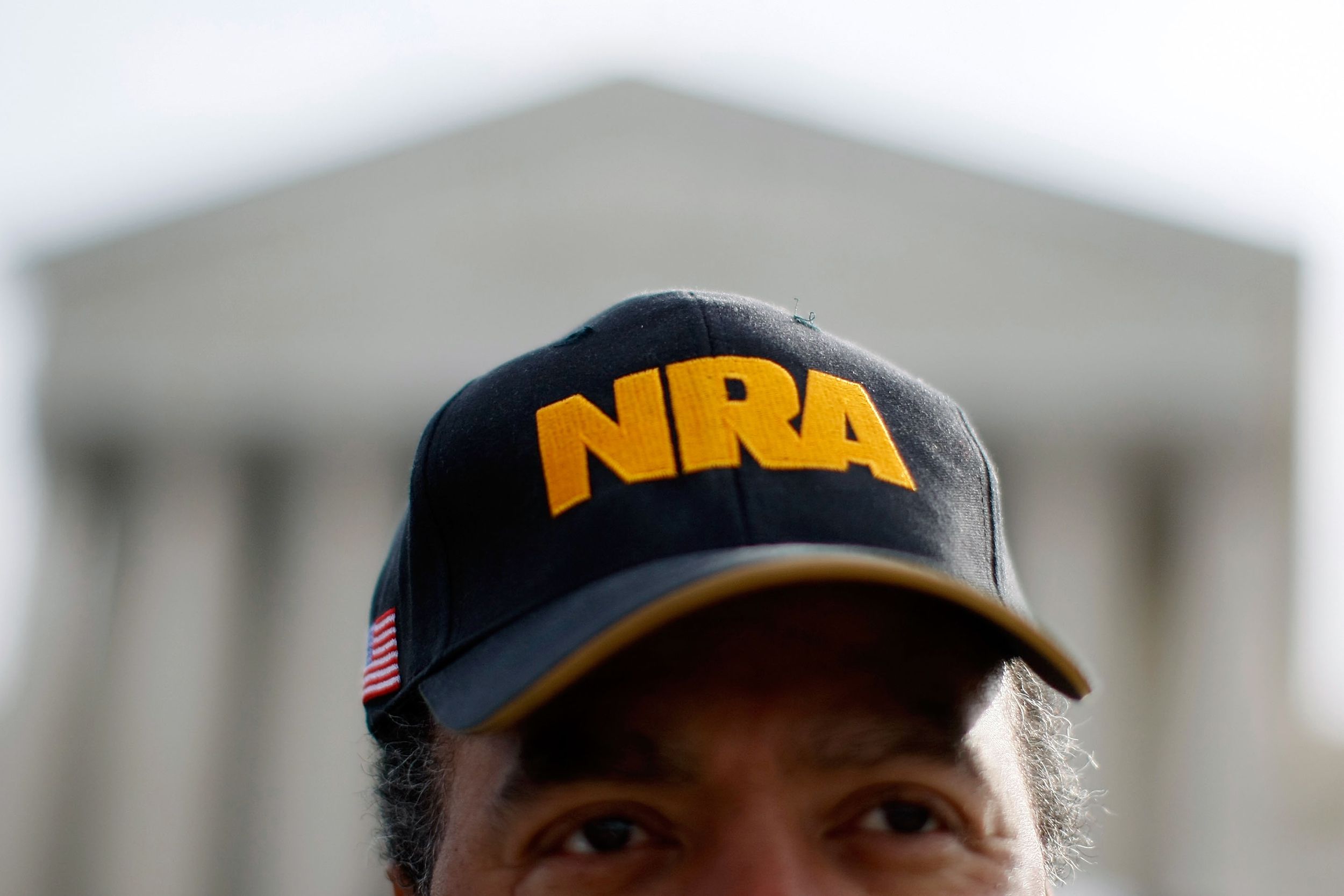 Steve Brown wears a NRA hat in front of the U.S. Supreme Court Building, March 18, 2008 in Washington, DC.