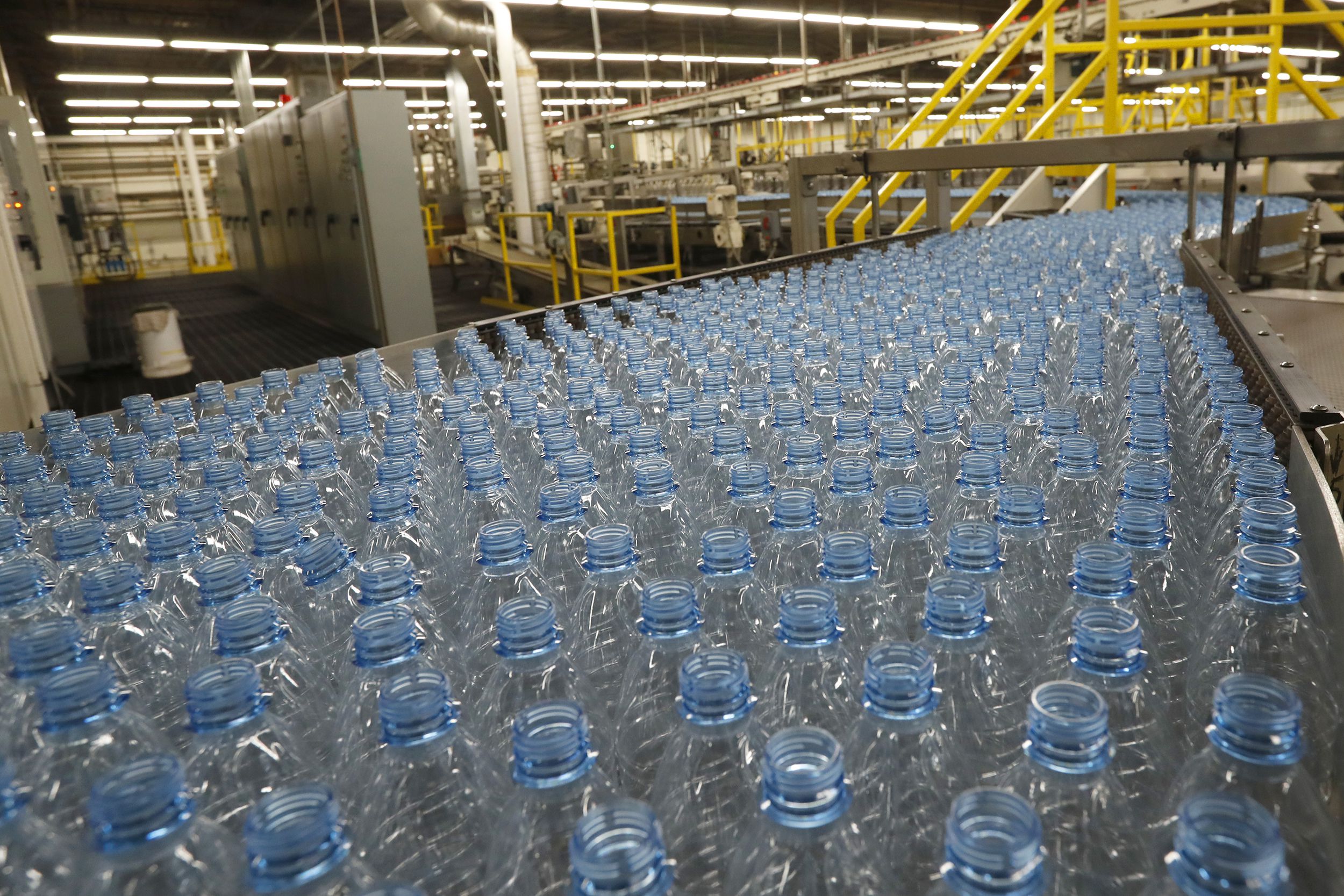 Empty plastic bottles move down a production line to be turned into Dasani bottled water at a Coco-Cola bottling plant on February 10, 2017 in Salt Lake City, Utah.