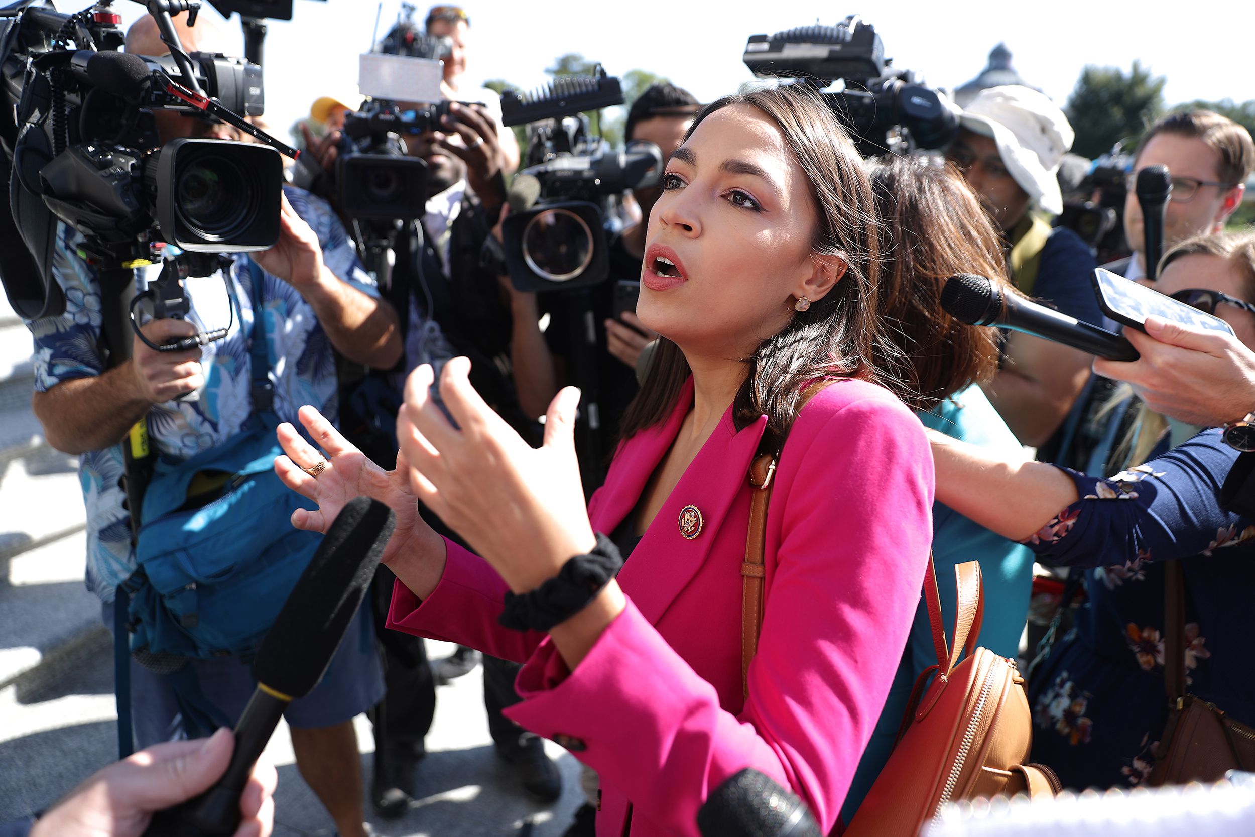 Rep. Alexandria Ocasio-Cortez (D-NY) talks to reporters before heading into the U.S. Capitol Building for final votes before a two-week state work period September 27, 2019 in Washington, DC.