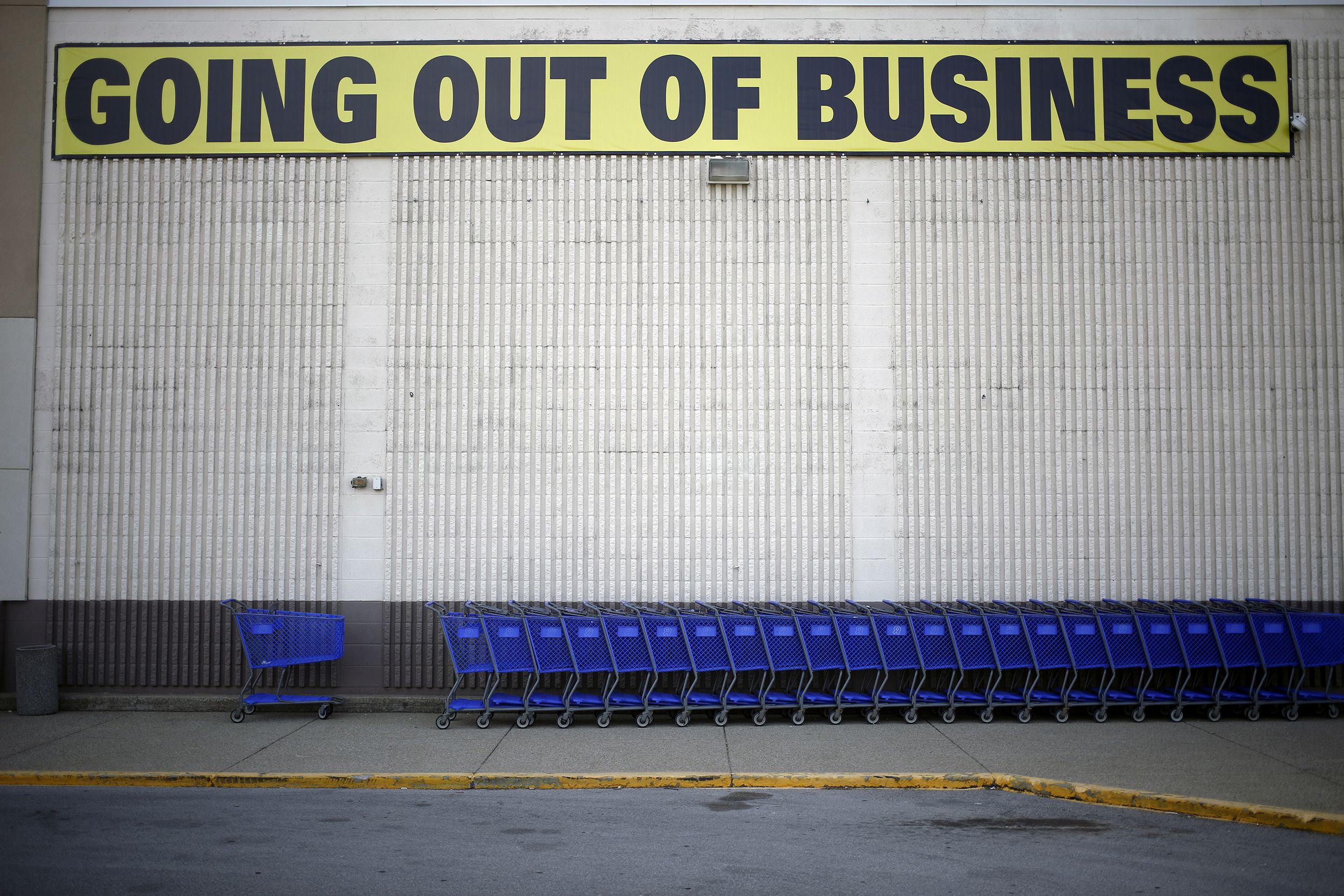 A "Going Out Of Business"sign is displayed outside a retail store in Kentucky.