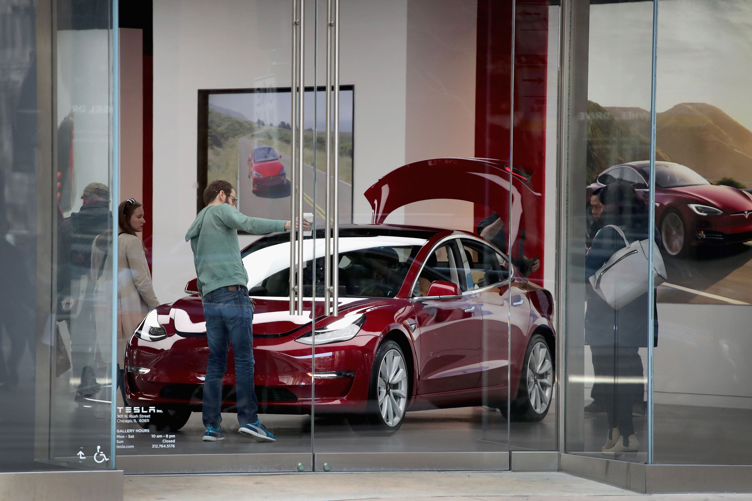 A Model 3 sits on the showroom floor at a Tesla dealership on March 30, 2018 in Chicago, Illinois.