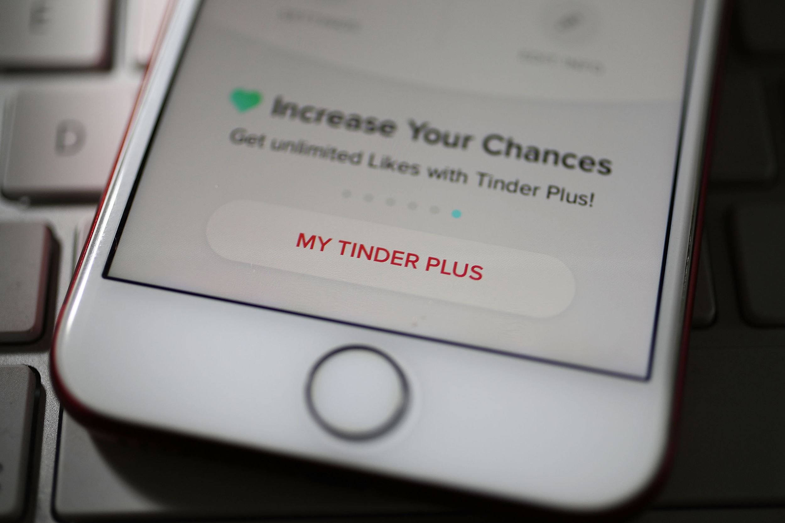 In this photo illustration, the dating app Tinder is seen on the screen of an iPhone on August 14, 2018 in Miami, Florida.