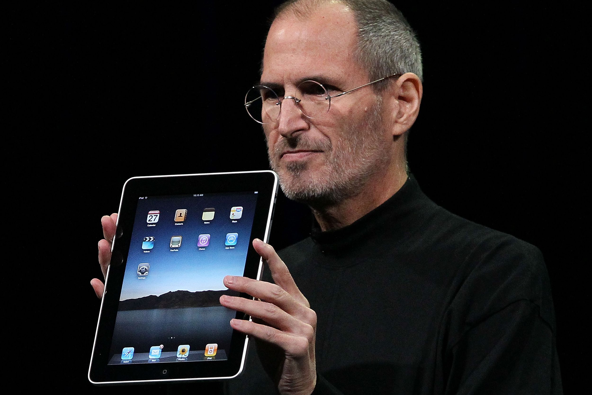 Apple Inc. CEO Steve Jobs holds up the new iPad as he speaks during an Apple Special Event at Yerba Buena Center for the Arts January 27, 2010 in San Francisco, California.