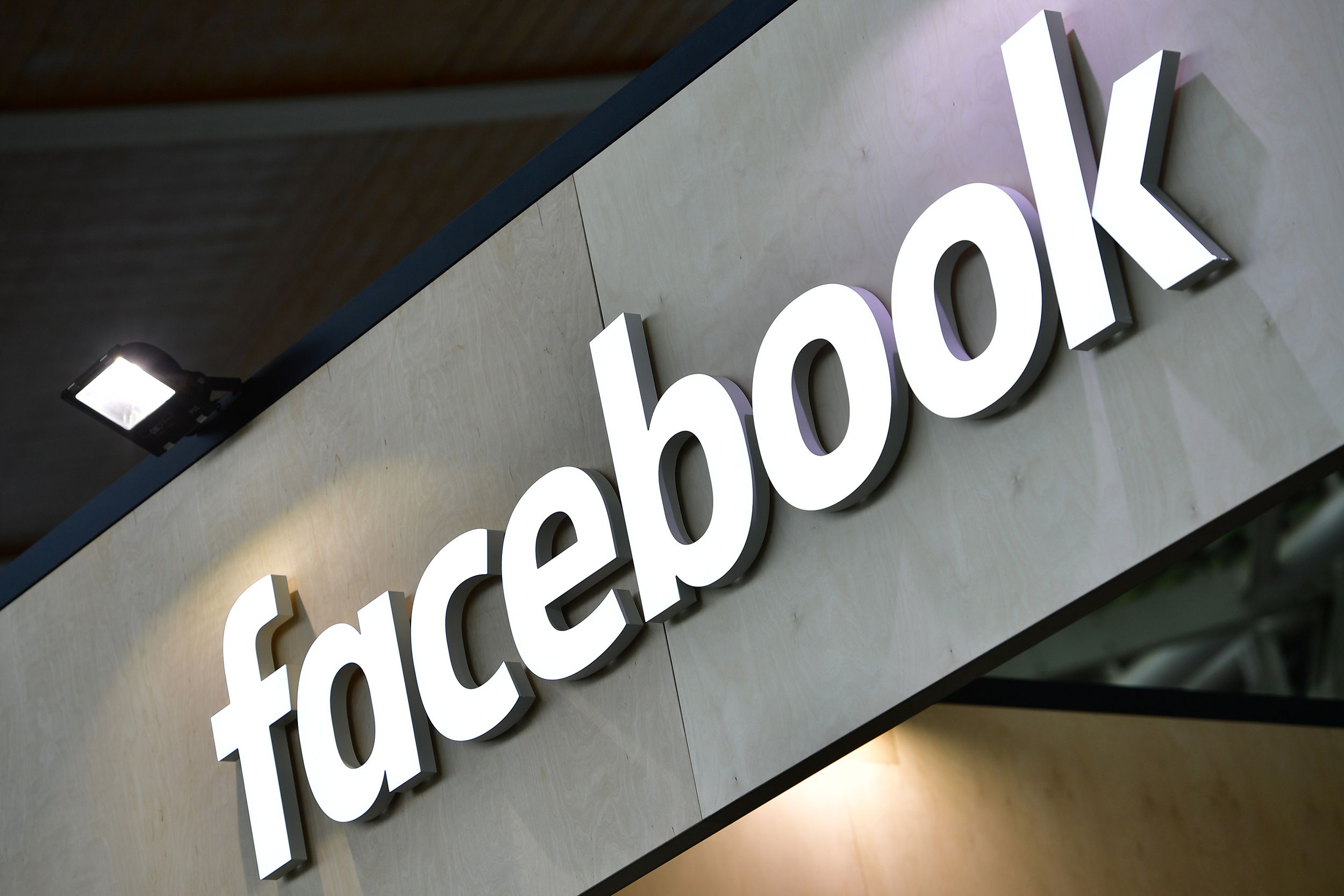 The Facebook logo is displayed at the 2018 CeBIT technology trade fair on June 12, 2018 in Hanover, Germany.