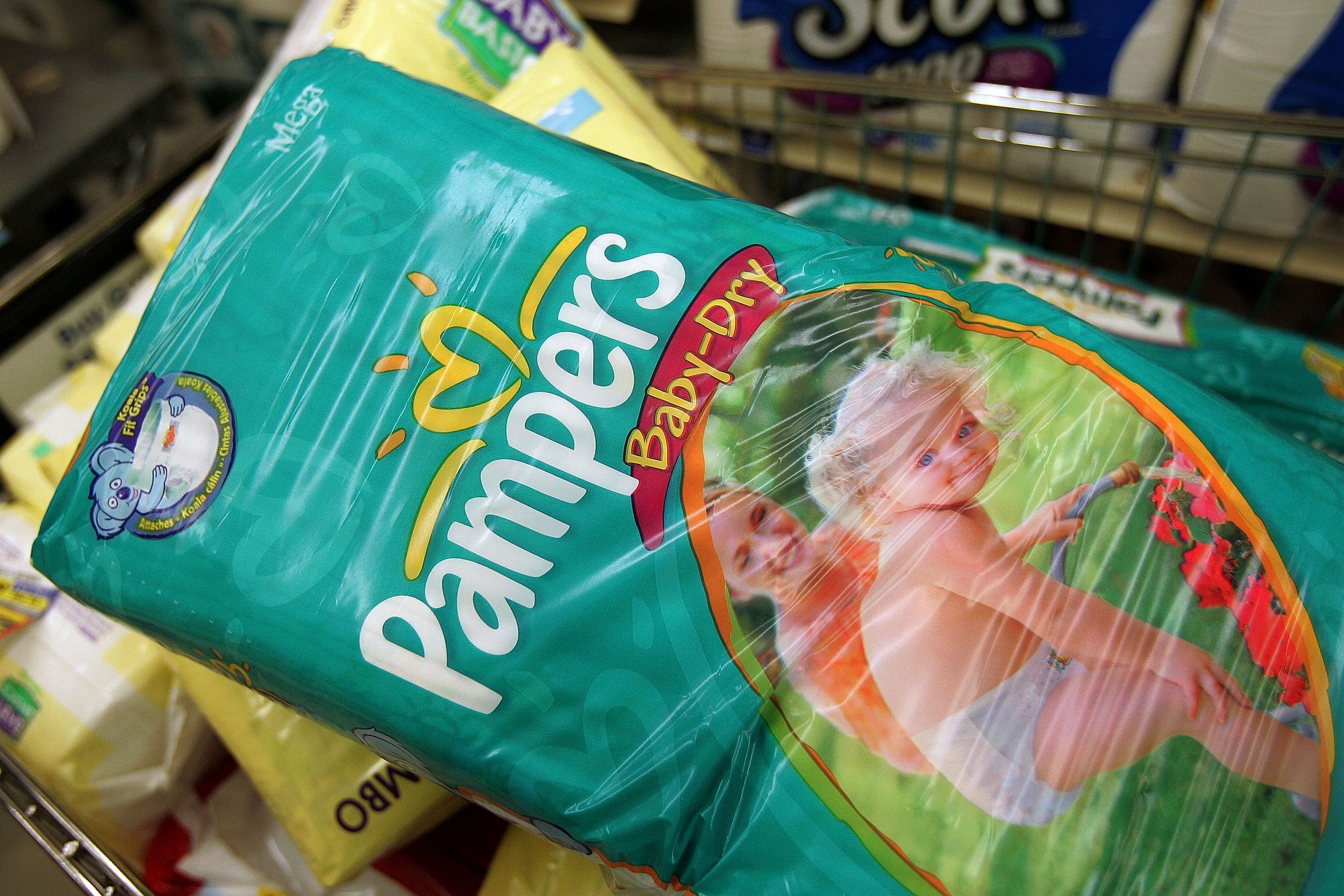 Procter & Gamble-brand Pampers diapers sit in a shopping cart in a grocery store April 27, 2005 in Chicago, Illinois.