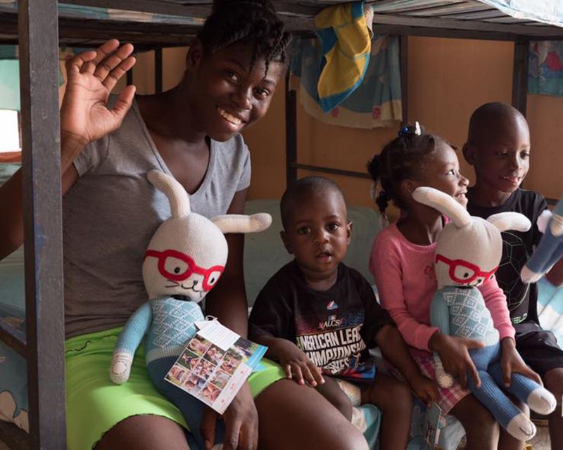 orphanage in haiti receiving dolls and meal donations