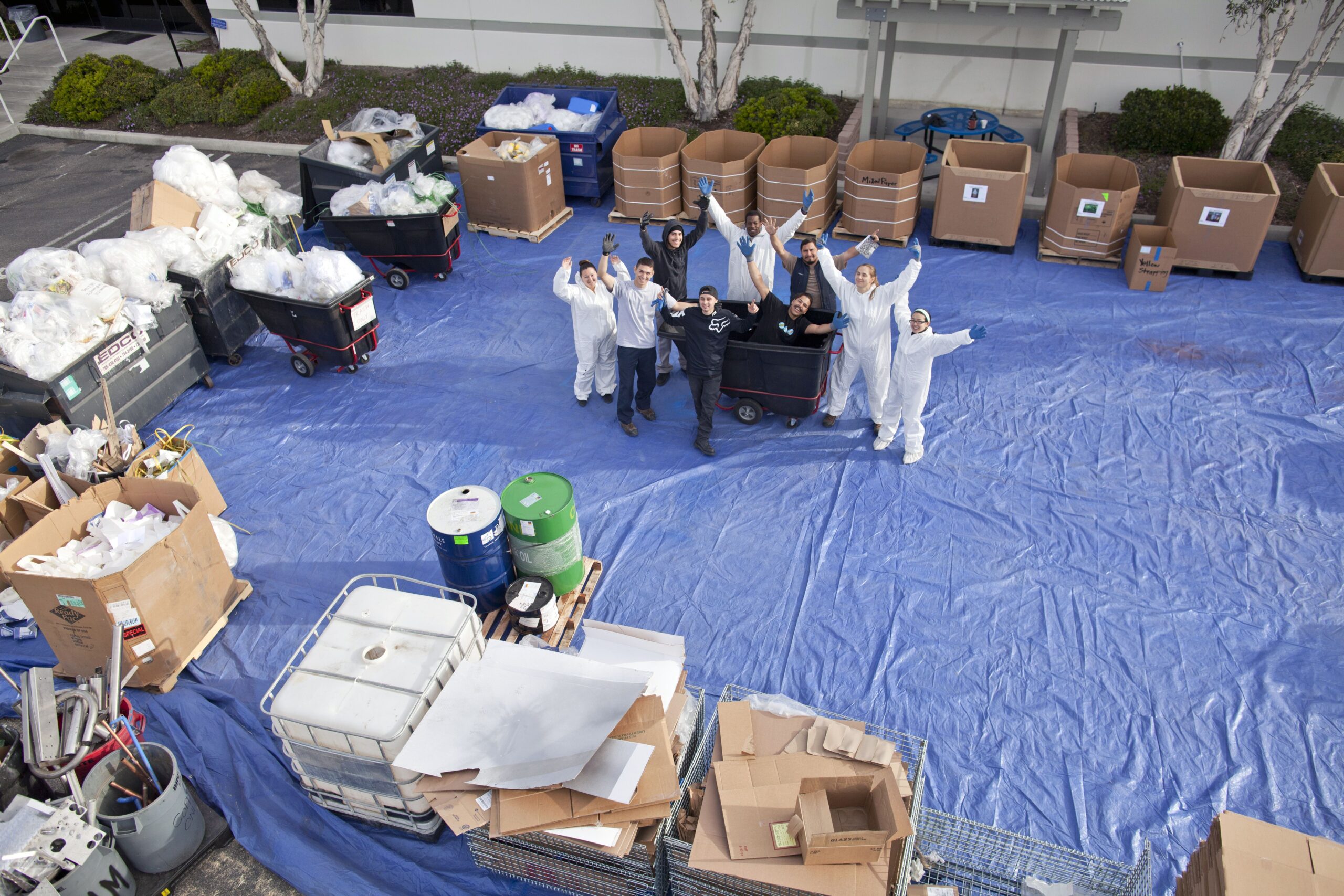 cross-departmental waste storing team working with company's waste stream