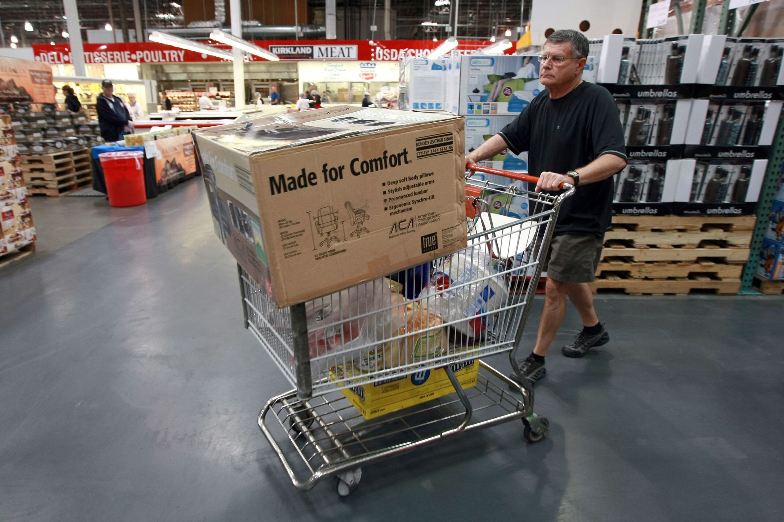 costco shopper with items in cart