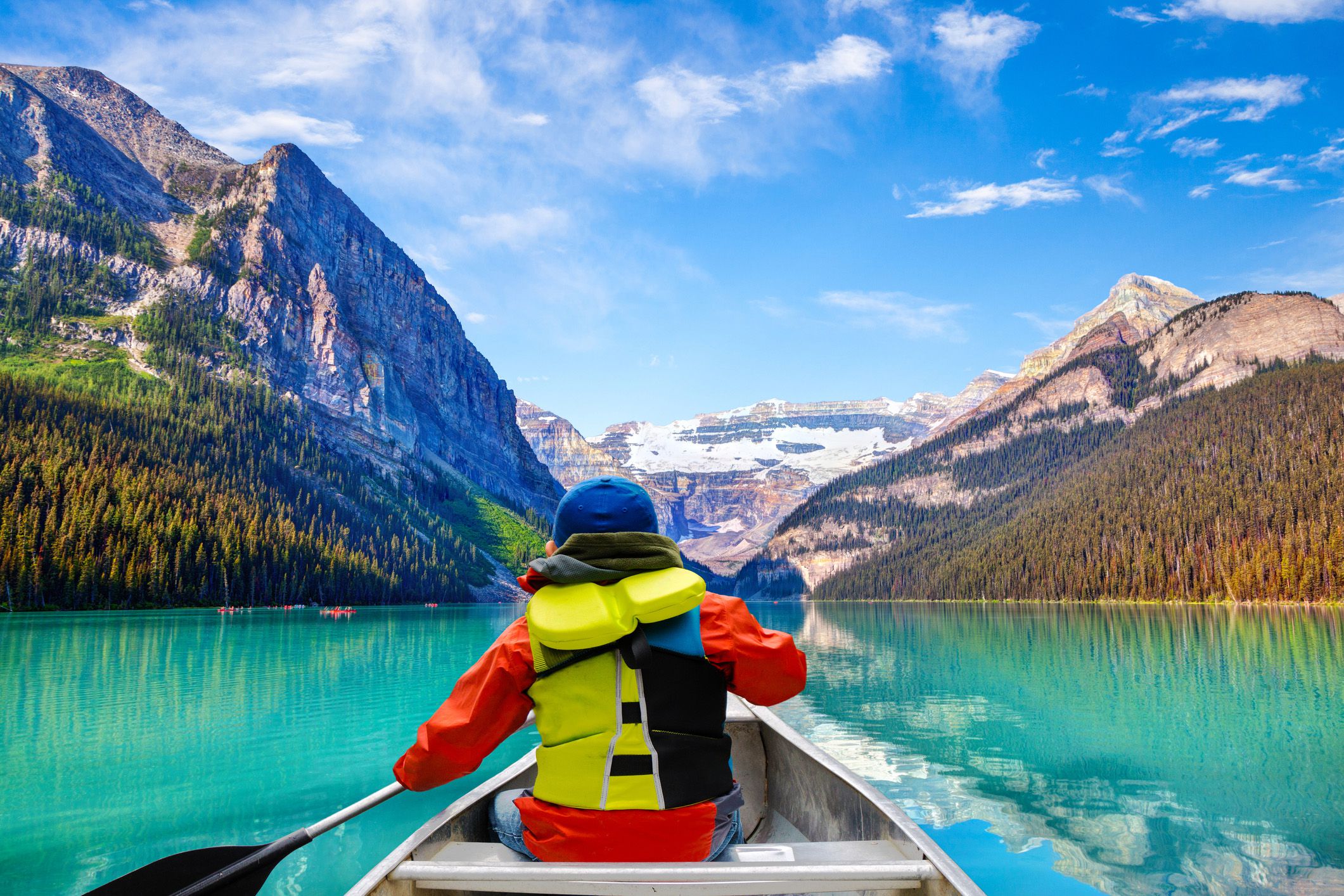 canoeing on lake louise in banff national park of the canadian rockies