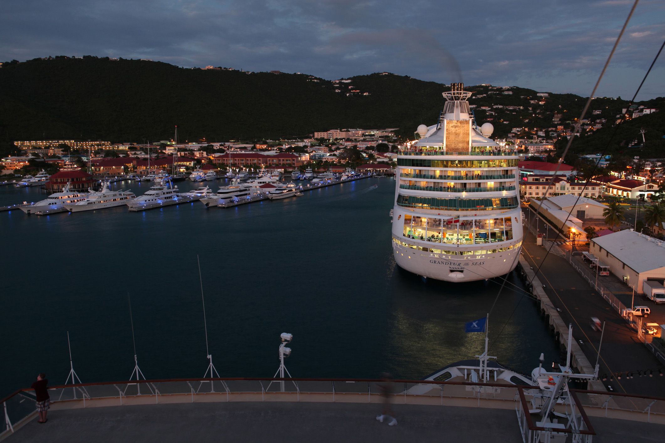 view by the celebrity mercury cruise ship at the dusk of the royal caribbean international ship grandeur of the seas anchored at charlotte amalie harbor, st. thomas