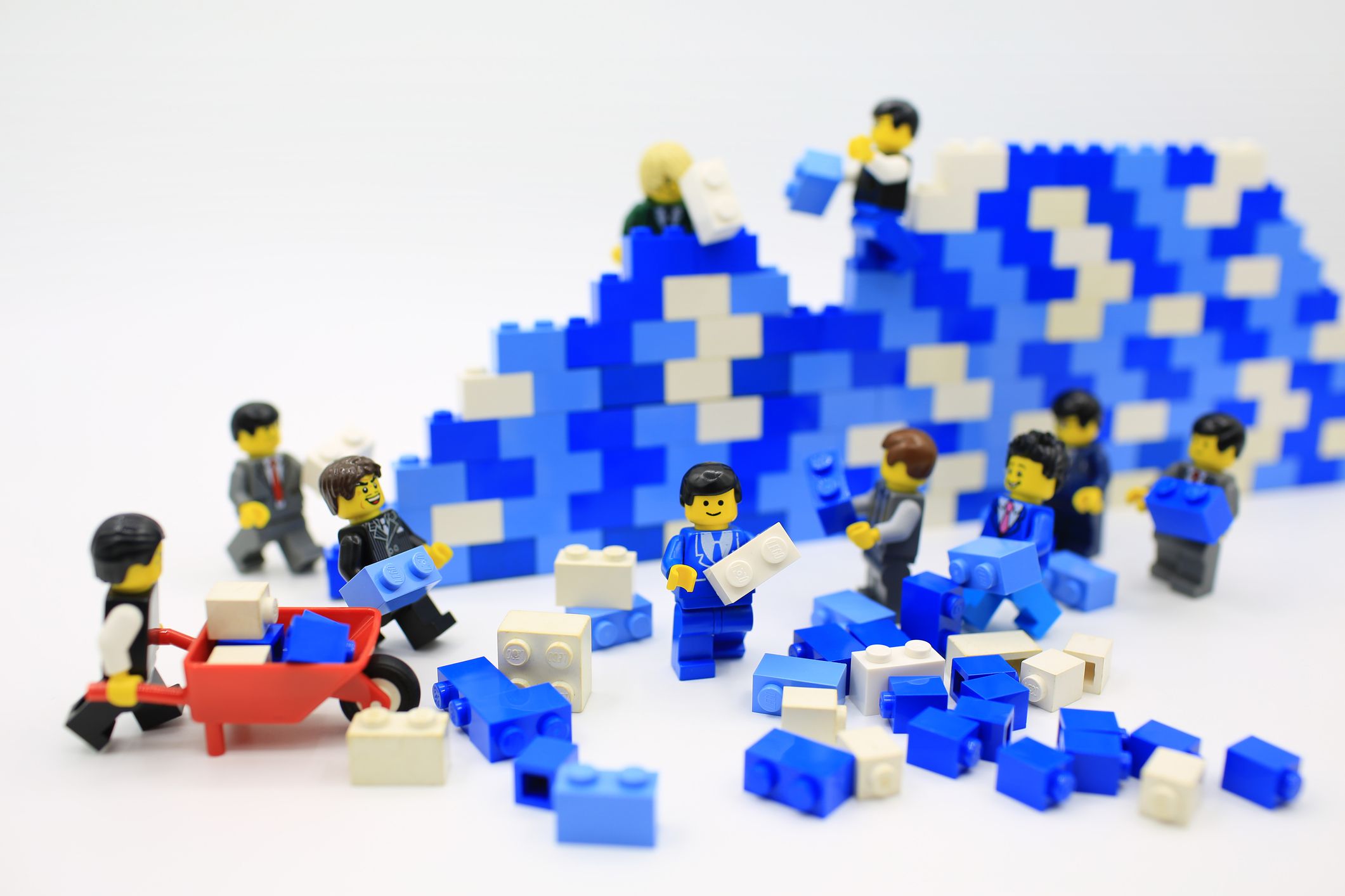 LEGO characters building a wall, together