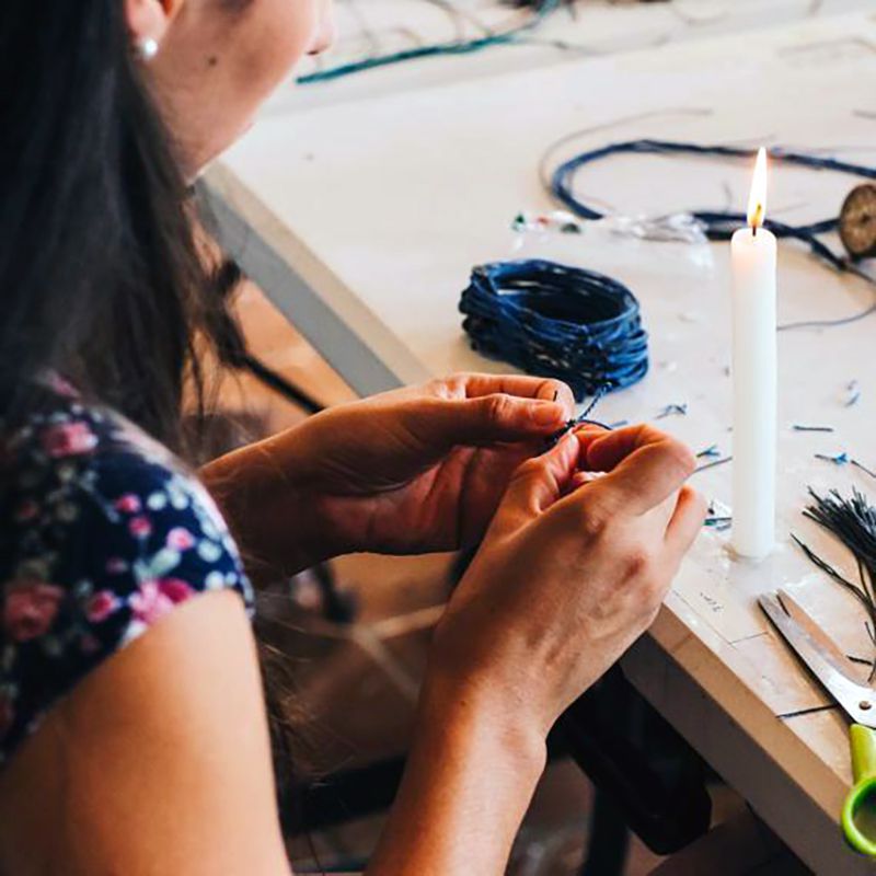 artisan making bracelet