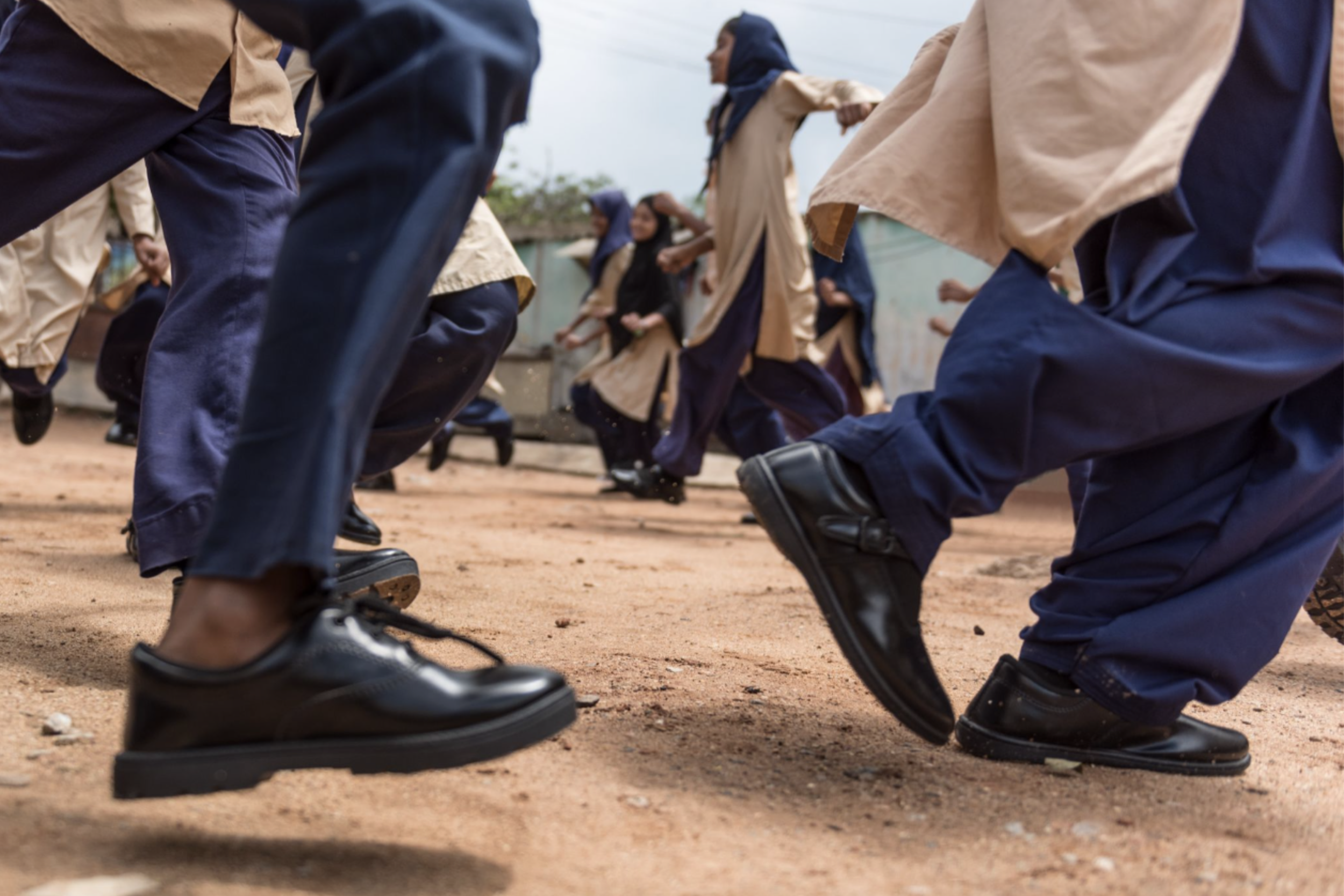 children wearing TOMS school shoes