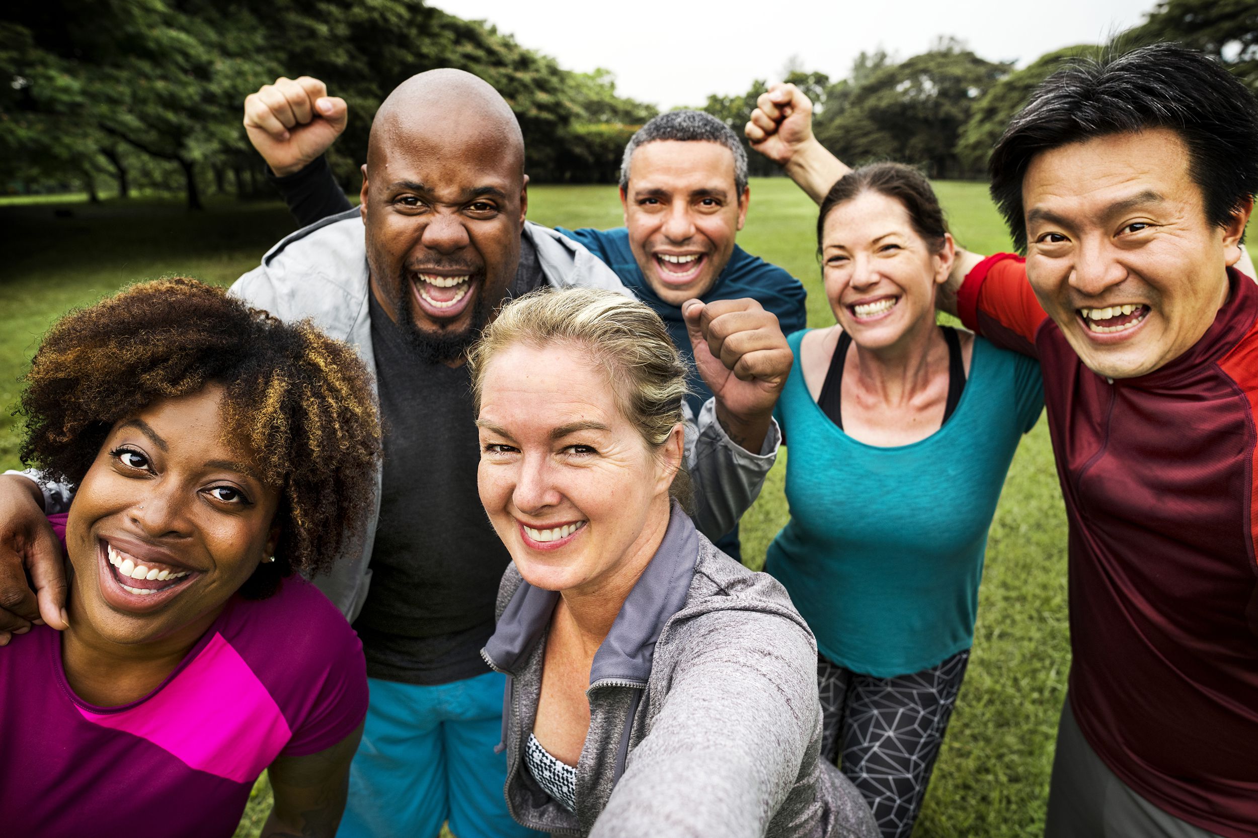 group of cheerful diverse friends in the park