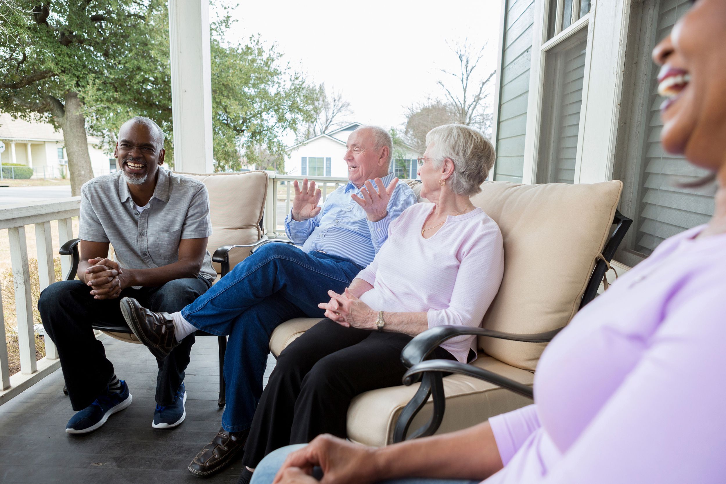 group of seniors talking on the porch