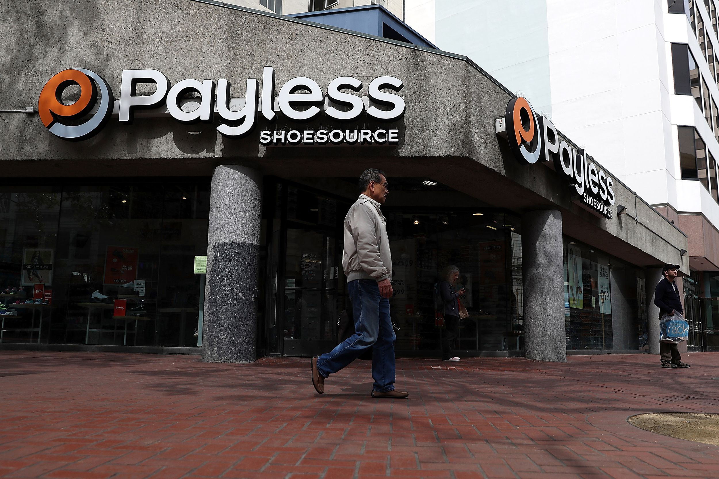 A pedestrian walks by a Payless Shoe Source store on April 5, 2017 in San Francisco, California.