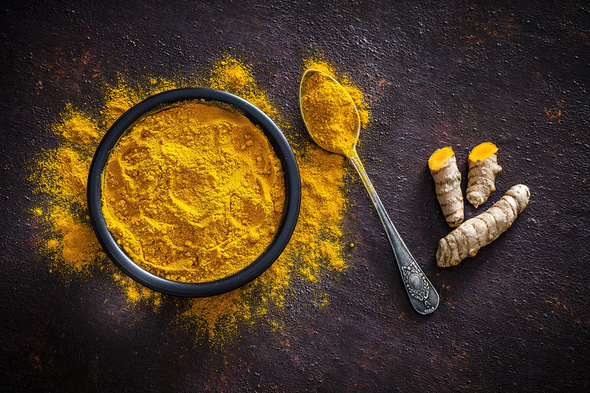 turmeric roots and powder shot from above