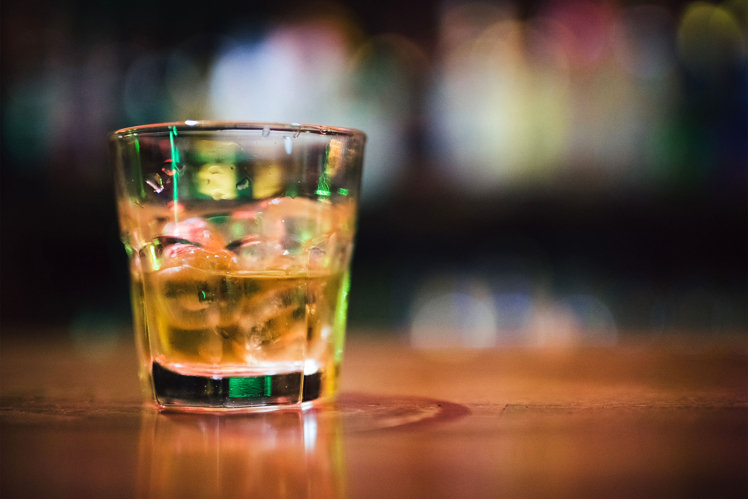 Whiskey glass on a bar