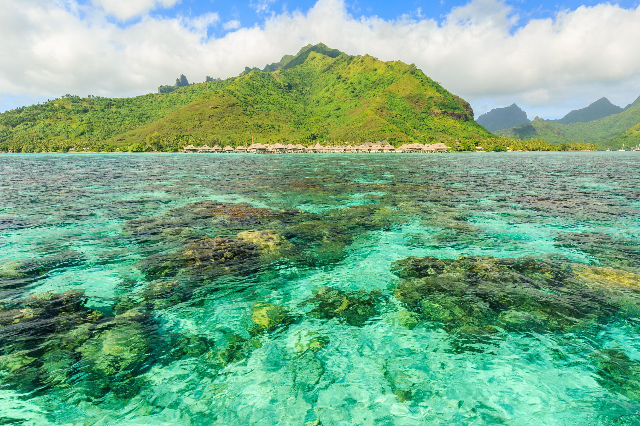 scenic view of sea and mountains against sky in papeete