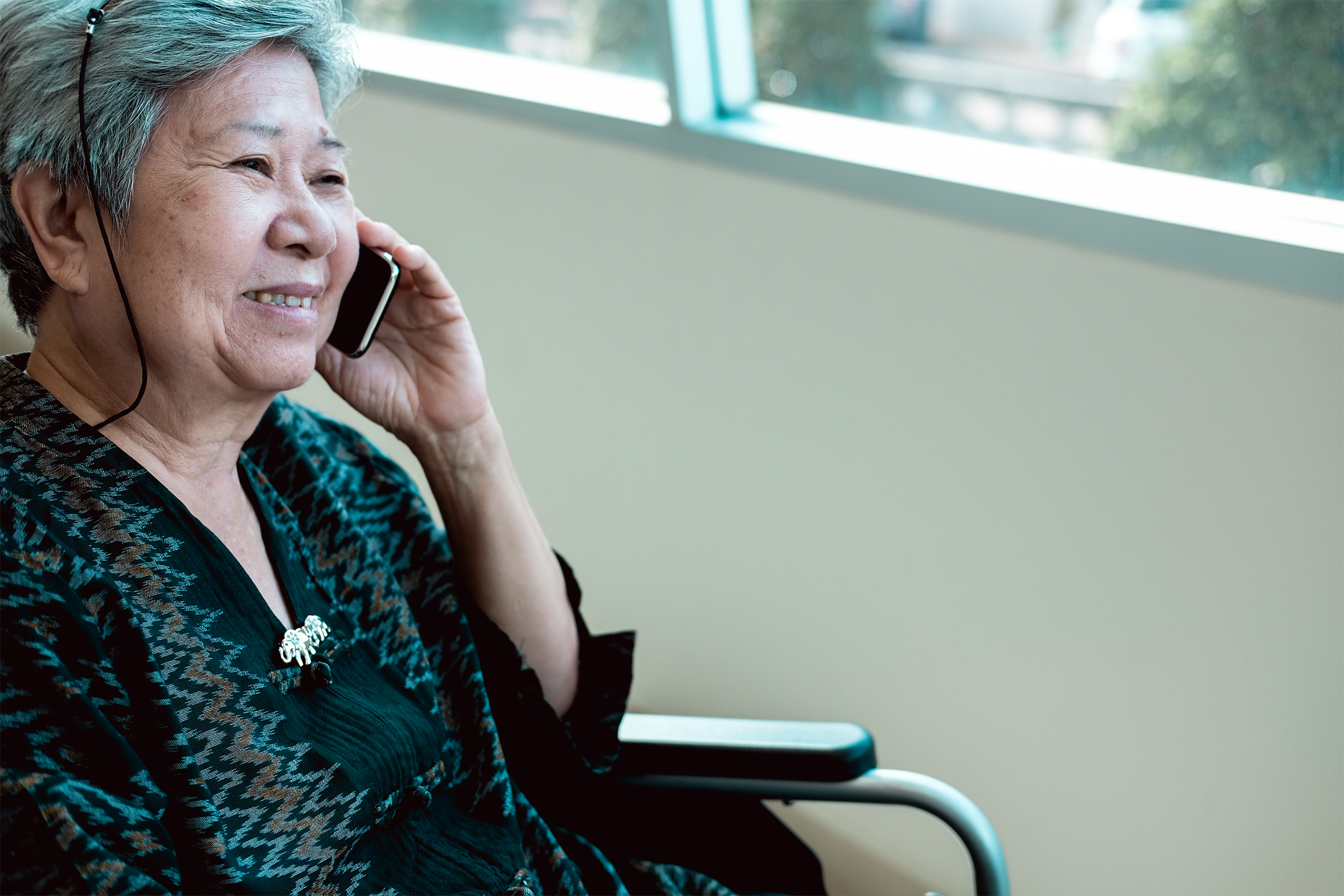 Asian woman talking on phone