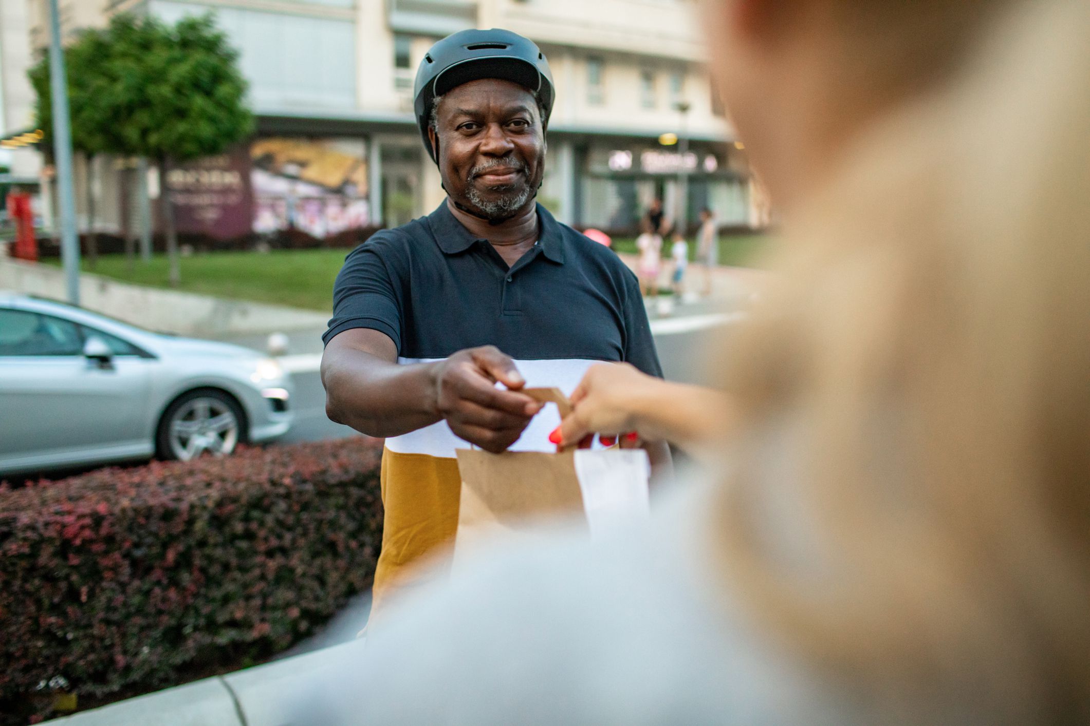 food delivery employee receiving food from restaurant