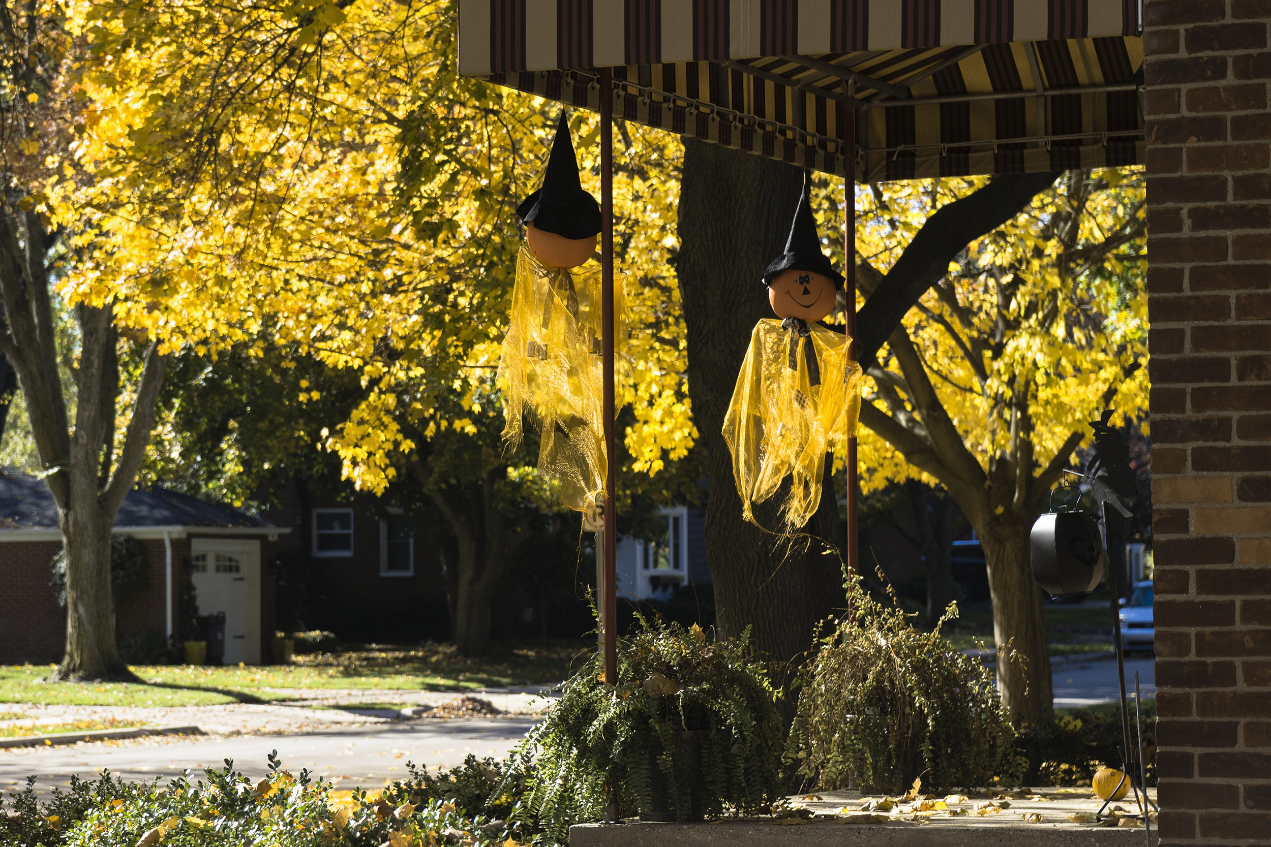 typical middle class home in Rochester, Michigan with Halloween decorations on a sunny day in fall