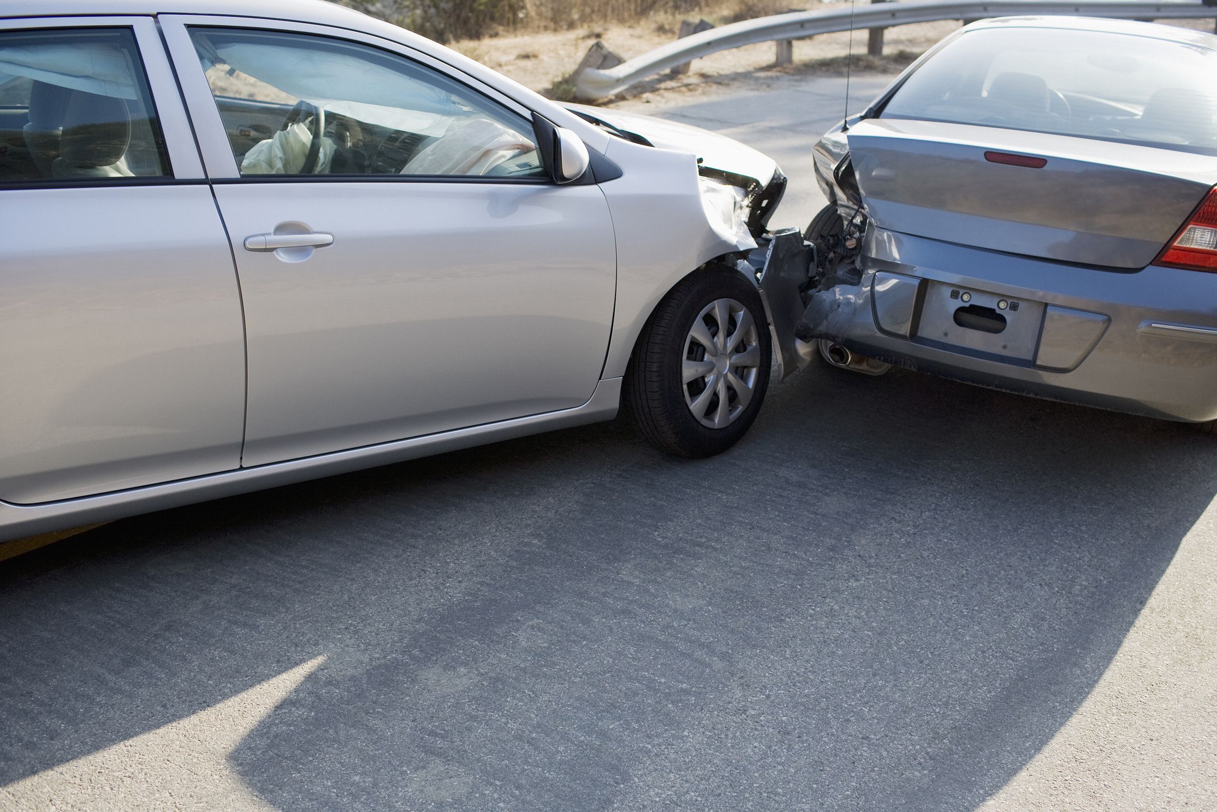 two cars in collision on roadway