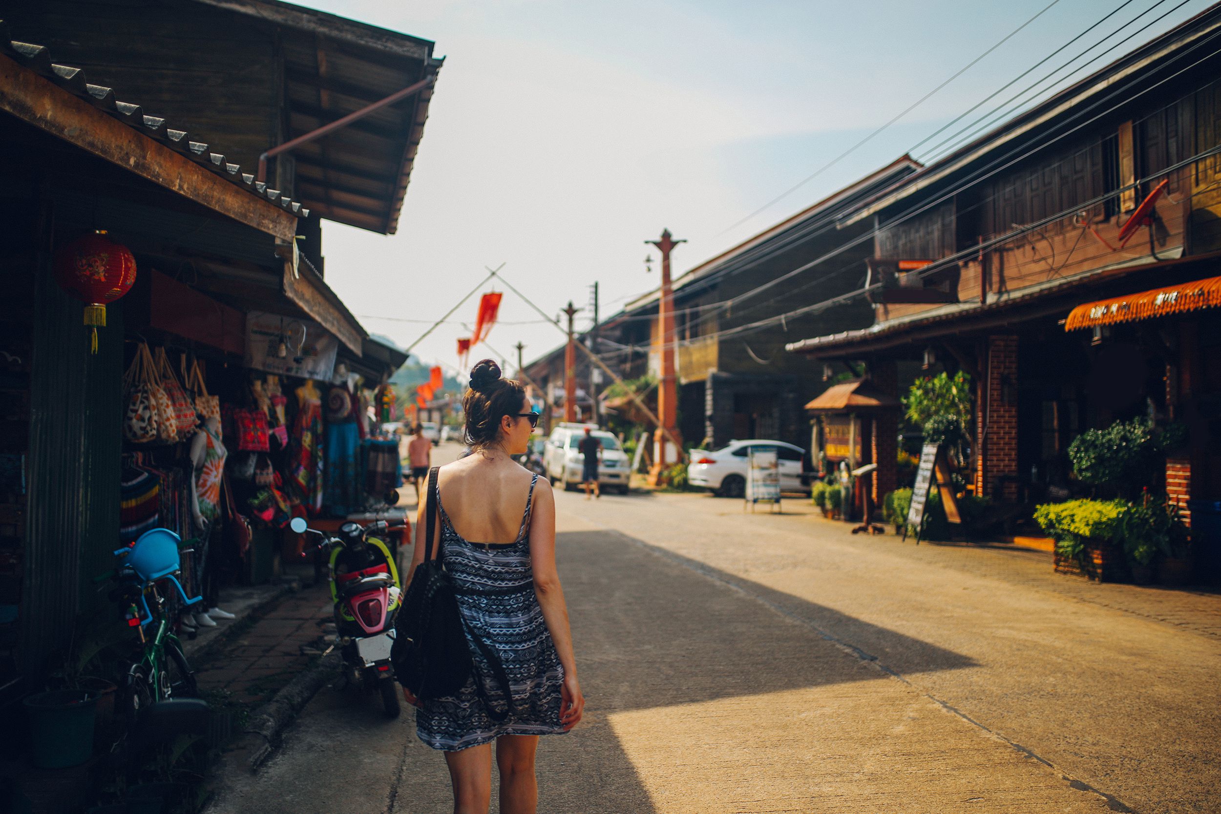 young woman walking in the Old Town of the Koh Lanta island, Thailand