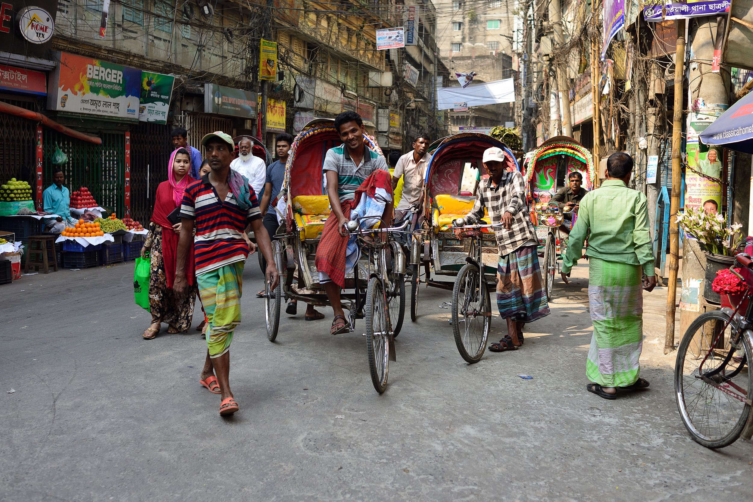 rickshaw driver on crowded streets of Dhaka in the Bangladesh