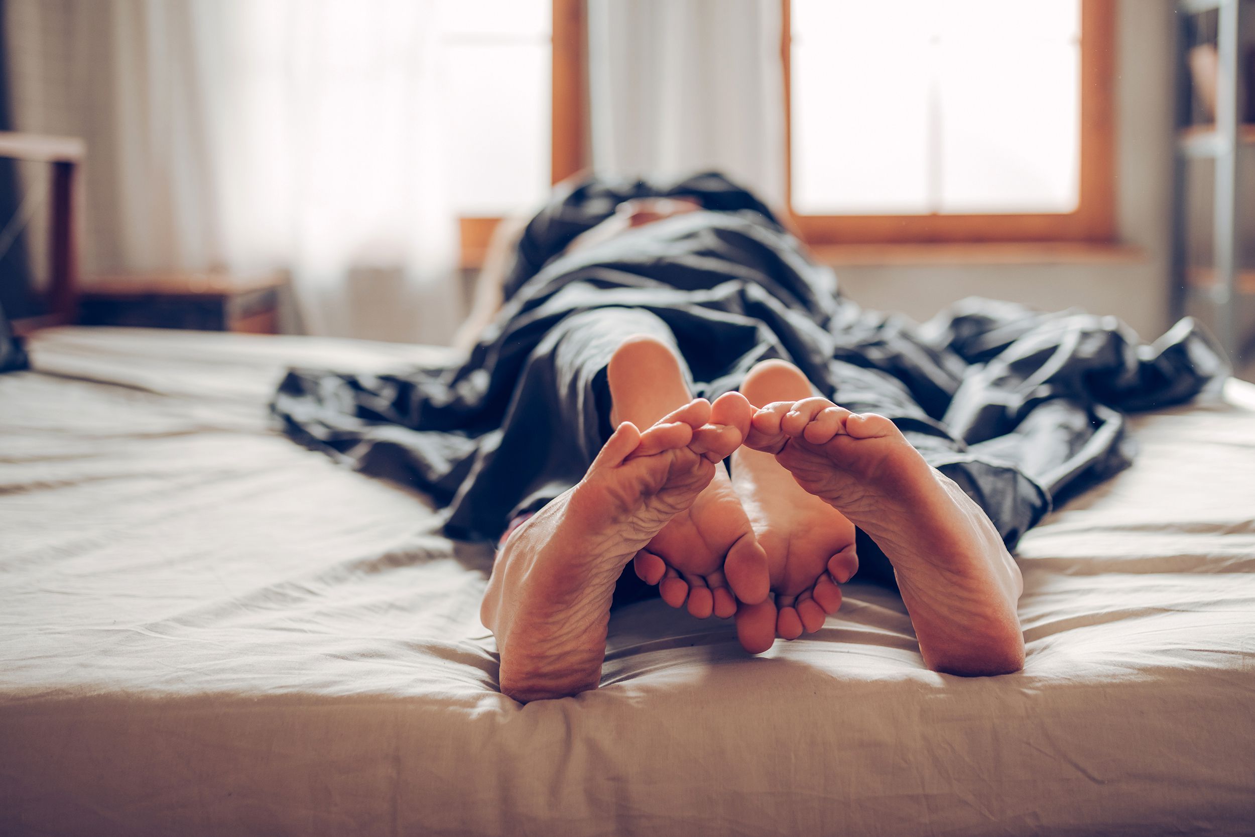 couple in bed hugging