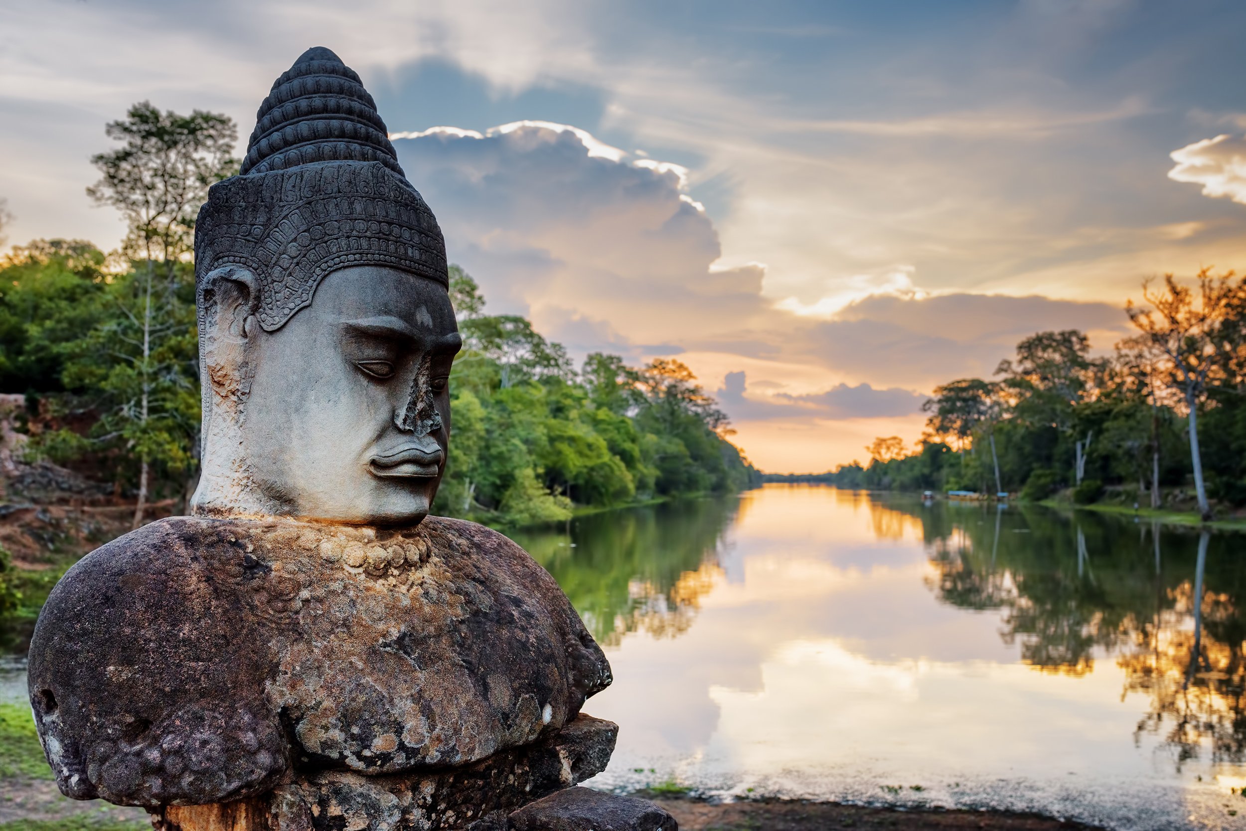 Stone Asura on causeway near South Gate of Angkor Thom in Siem Reap, Cambodia