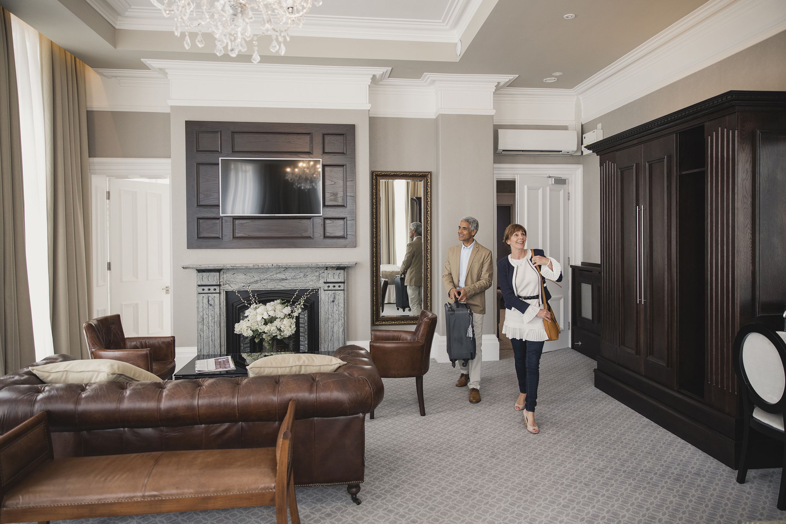 couple walking into fancy hotel room