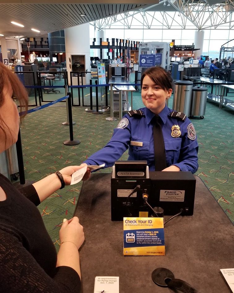 tsa agent checking id at airport