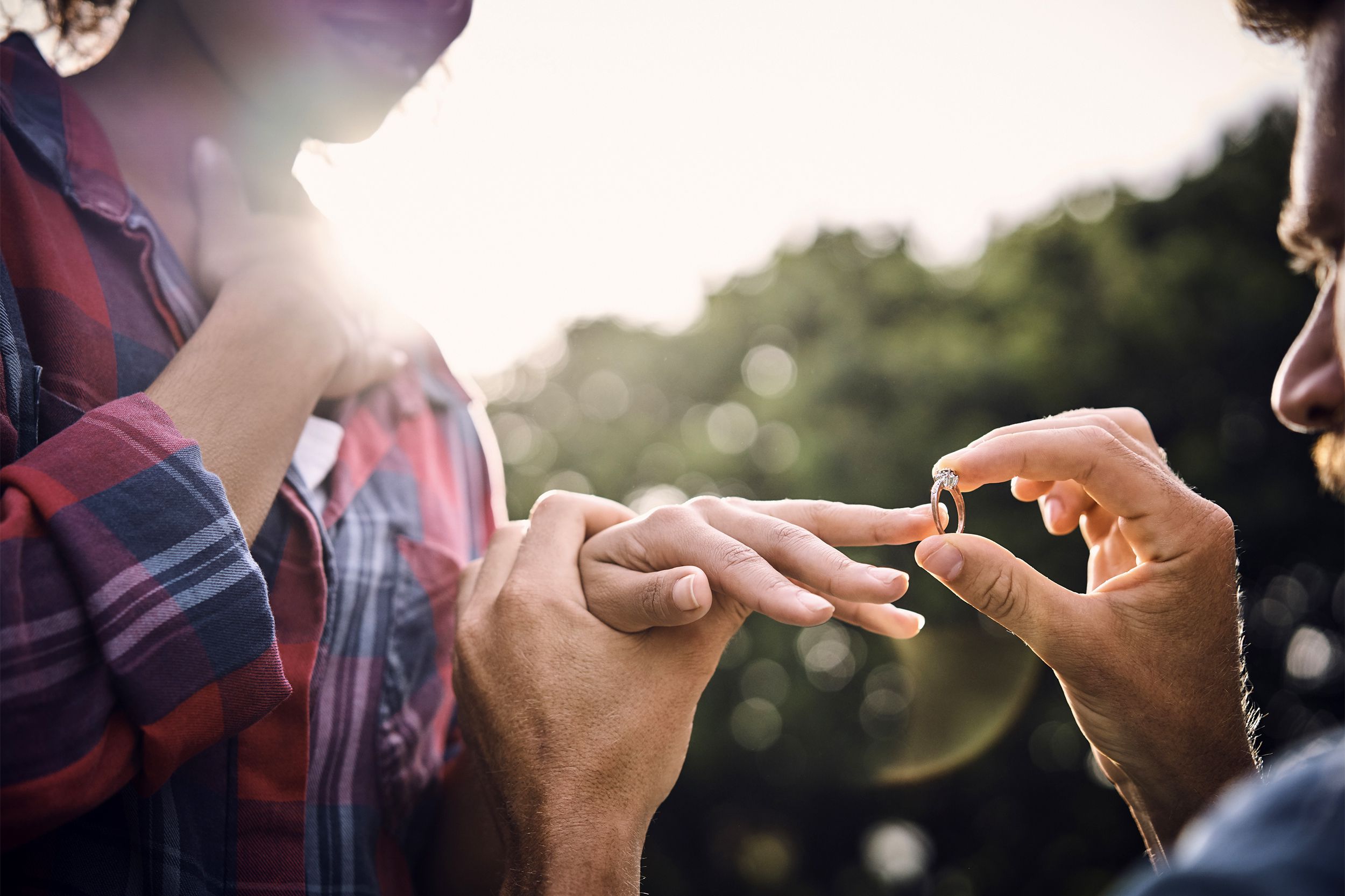 Putting an engagement ring on a woman's finger