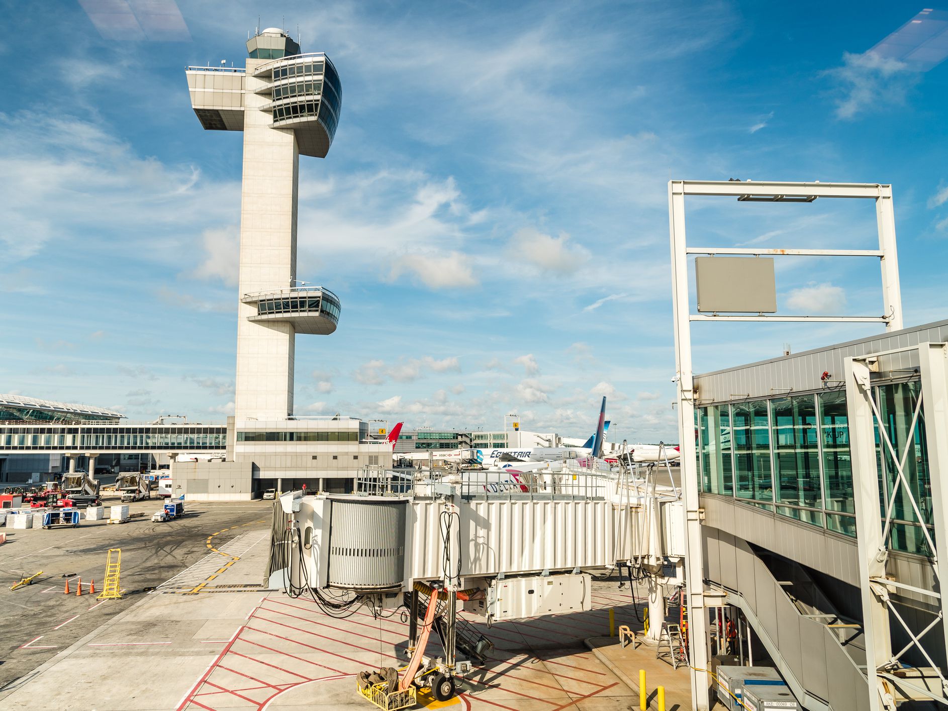 New York City, USA-June 26, 2018: Aircrafts in runway of JFK Airport against blue sky