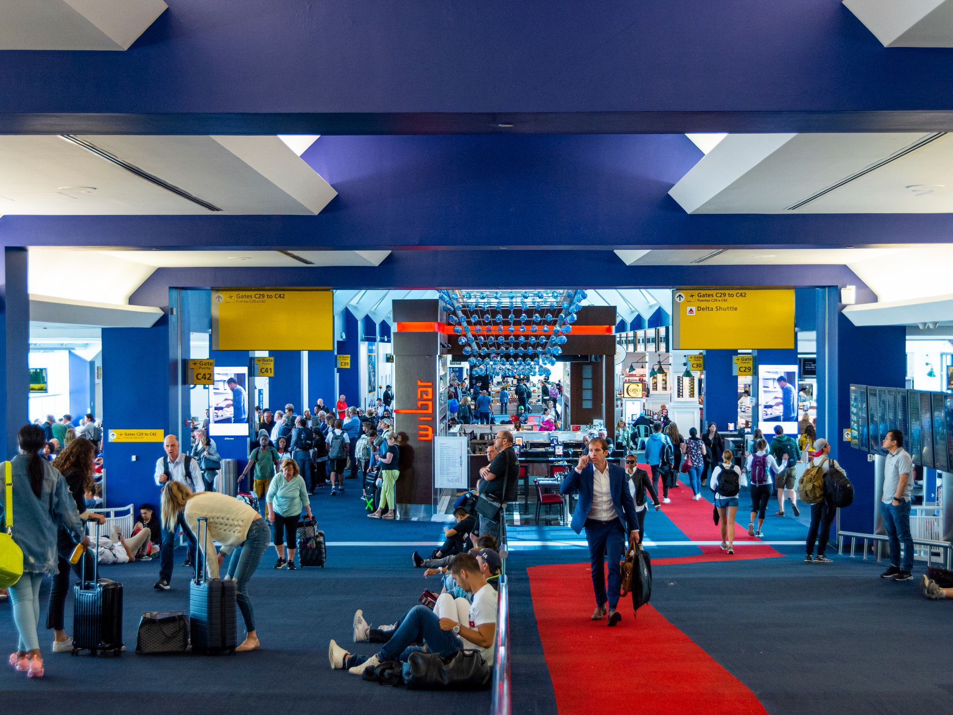 New York City, NY, United States-June 3, 2019: People walking inside the Terminal C at LaGuardia Airport in New York, NY.