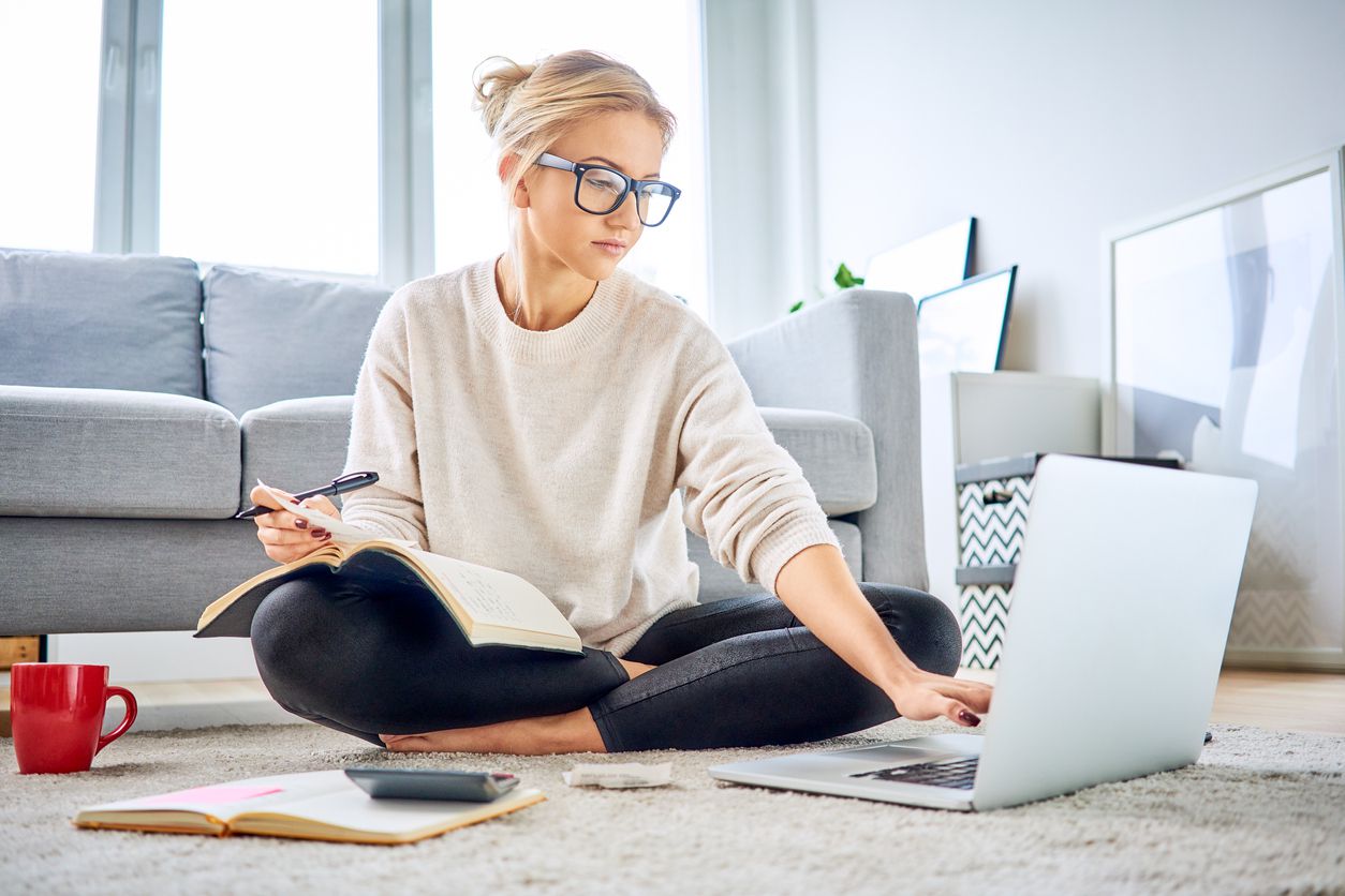 Woman looking at taxes on computer