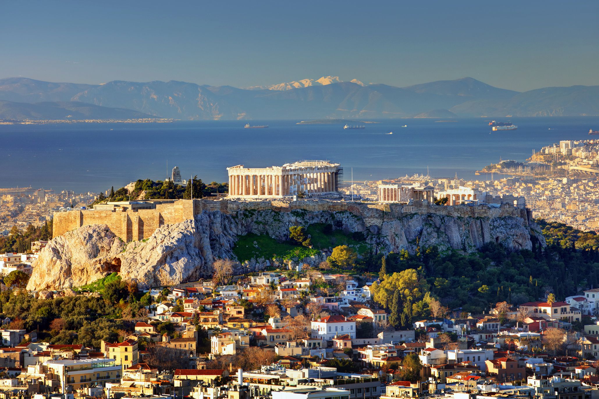 Aerial view over Athens with te Acropolis and harbour from Lycabettus hill, Greece at sunriseTomasSereda