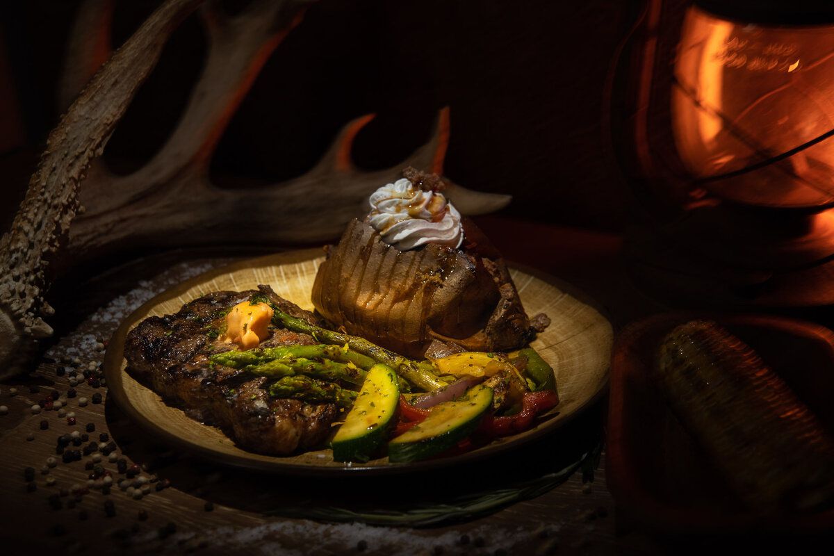 steak with vegetables and potato at Bama Bucks, Sardis City, Alabama