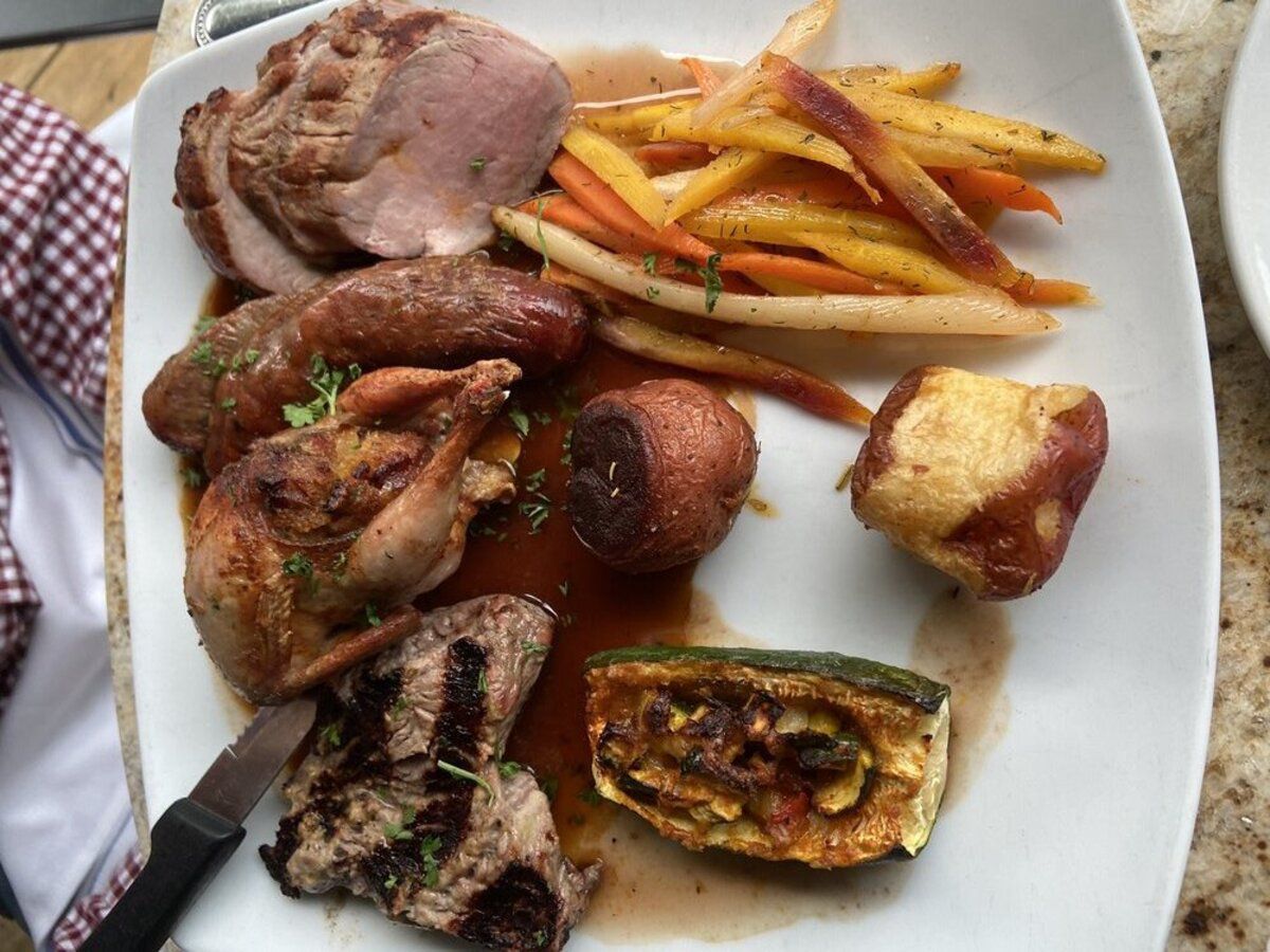 mixed grill with beef tenderloin, pork tenderloin, quail, and venison sausage at Brave New Restaurant, Little Rock, Arkansas