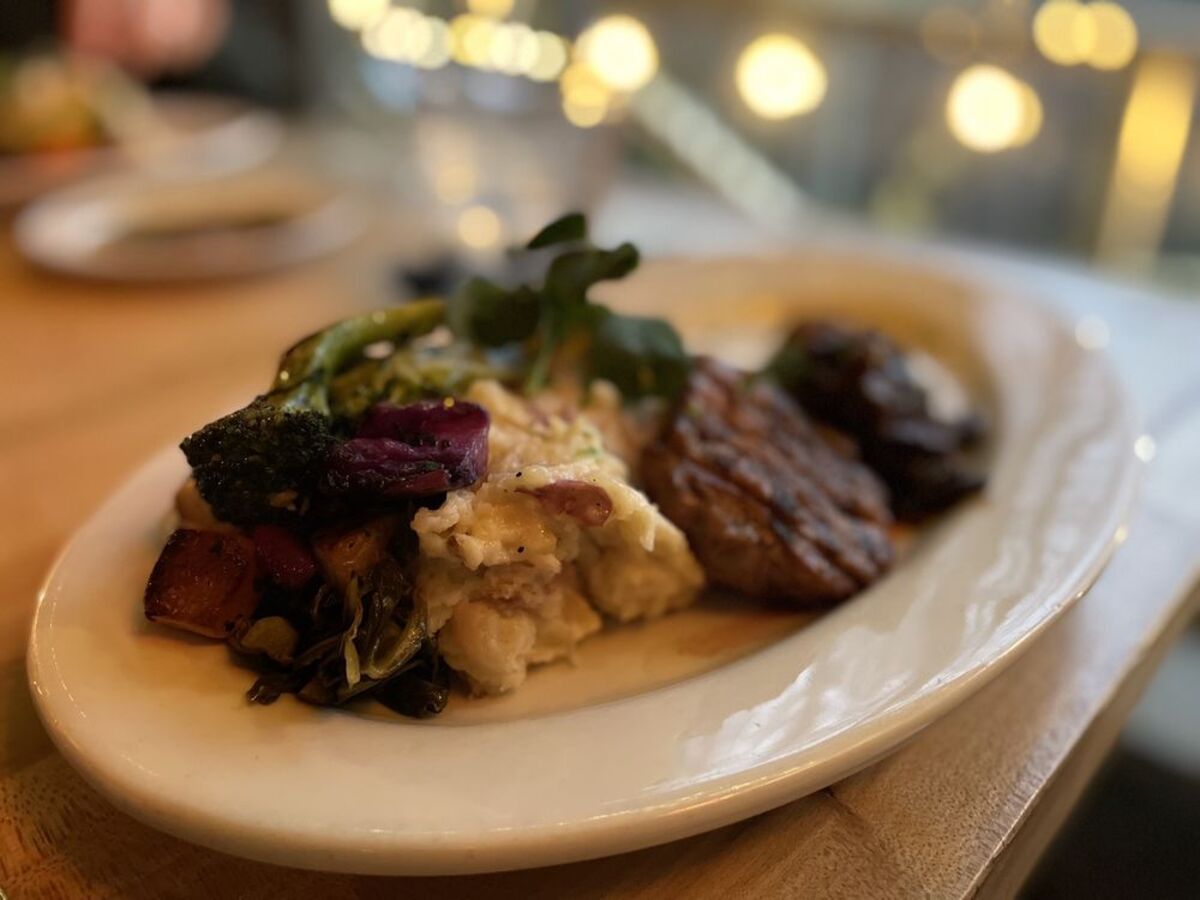 Long Island duck on plate at the patio of Gamekeeper, Boone, North Carolina
