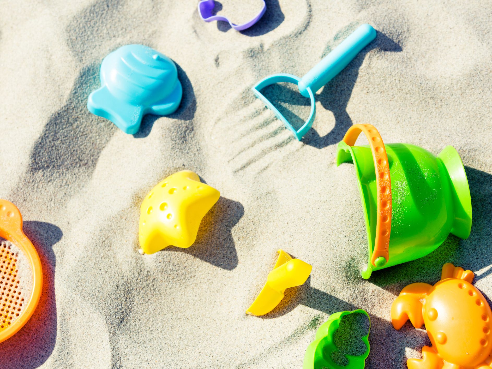 Colorful baby sand toys on the beach