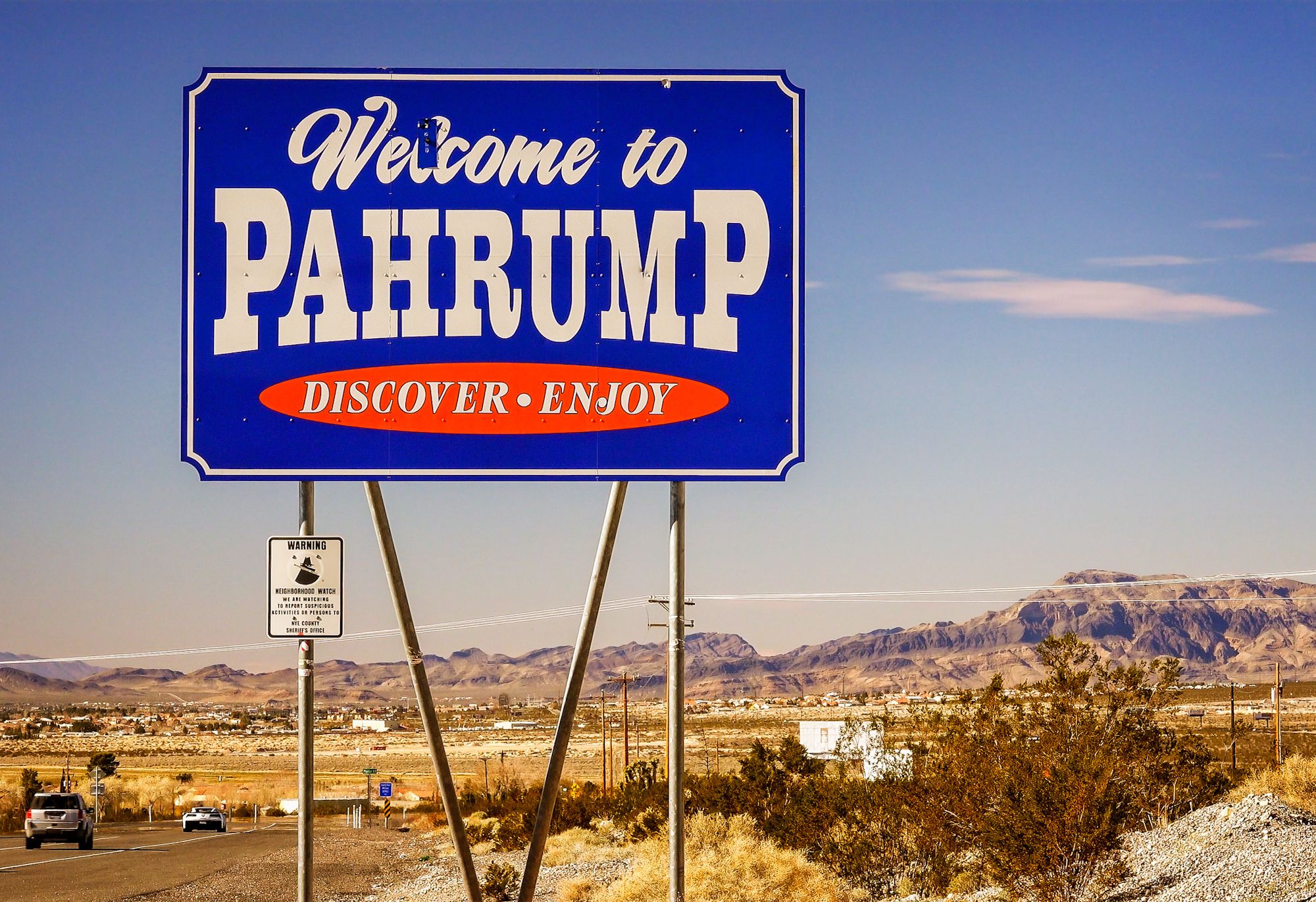 Pahrump, United States-February 17, 2016: Traffic passes the Welcome to Pahrump Nevada sign