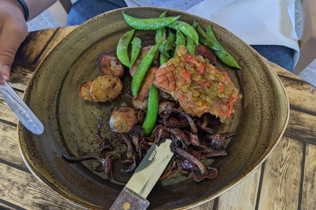 wild game entree with vegetables on plate at the patio of Timbers Inn, Rockford, Michigan
