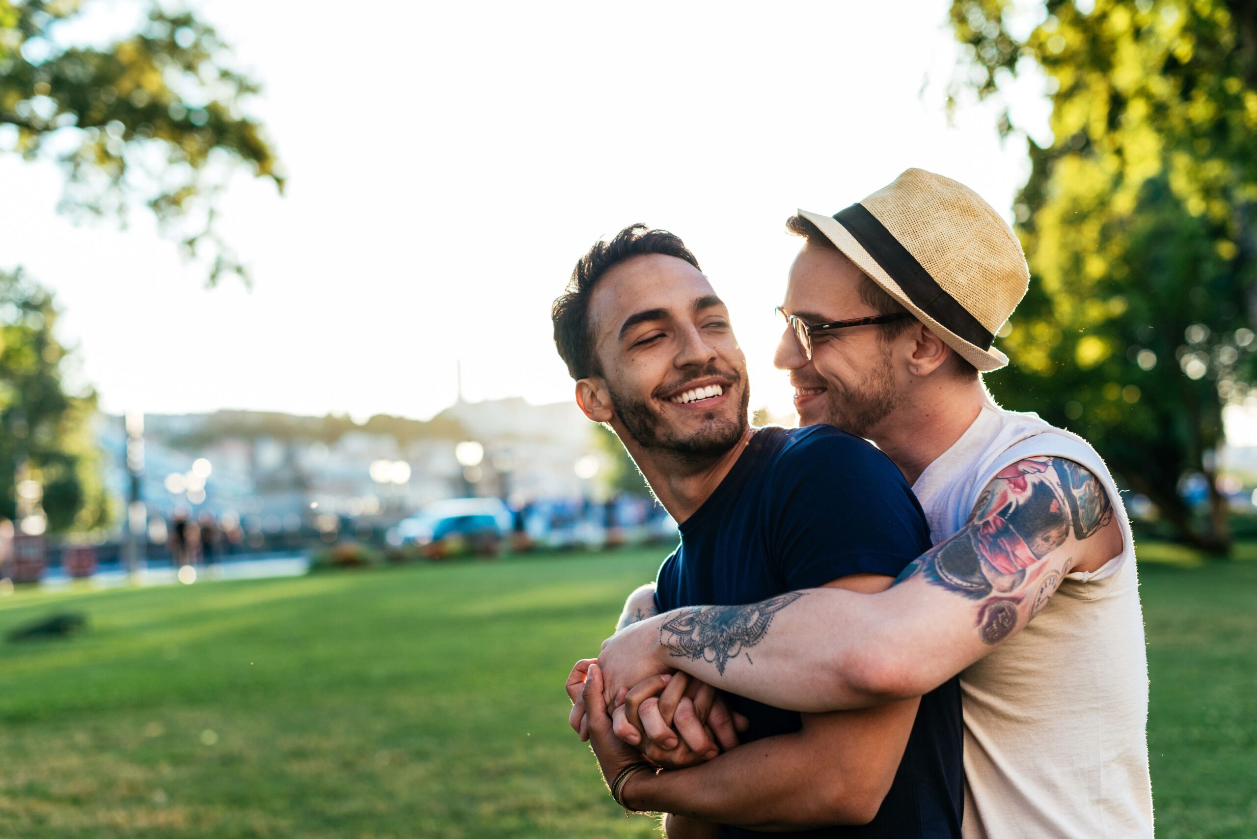 Gay couple hugging in the park