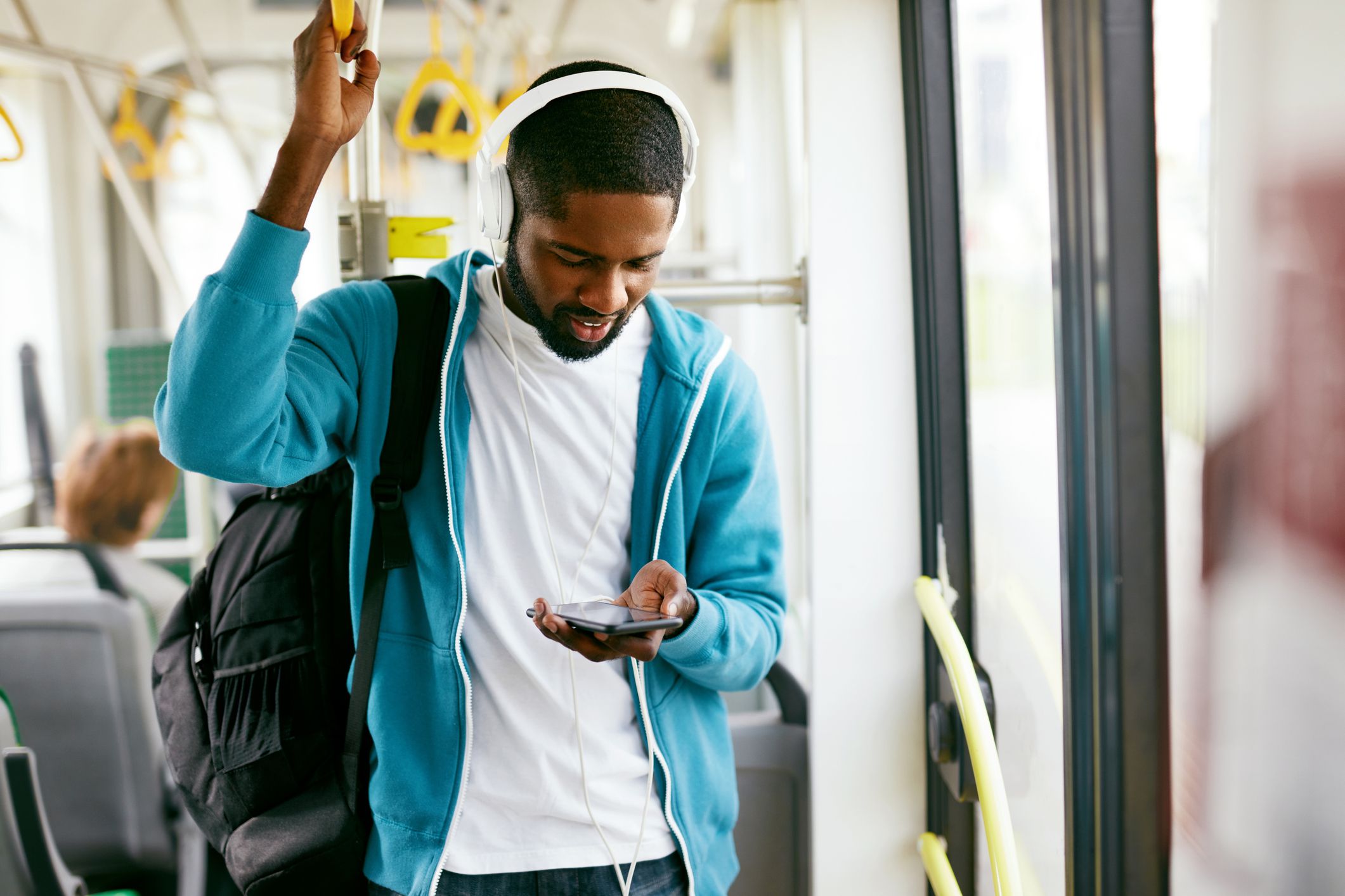 man on bus wearing headphones