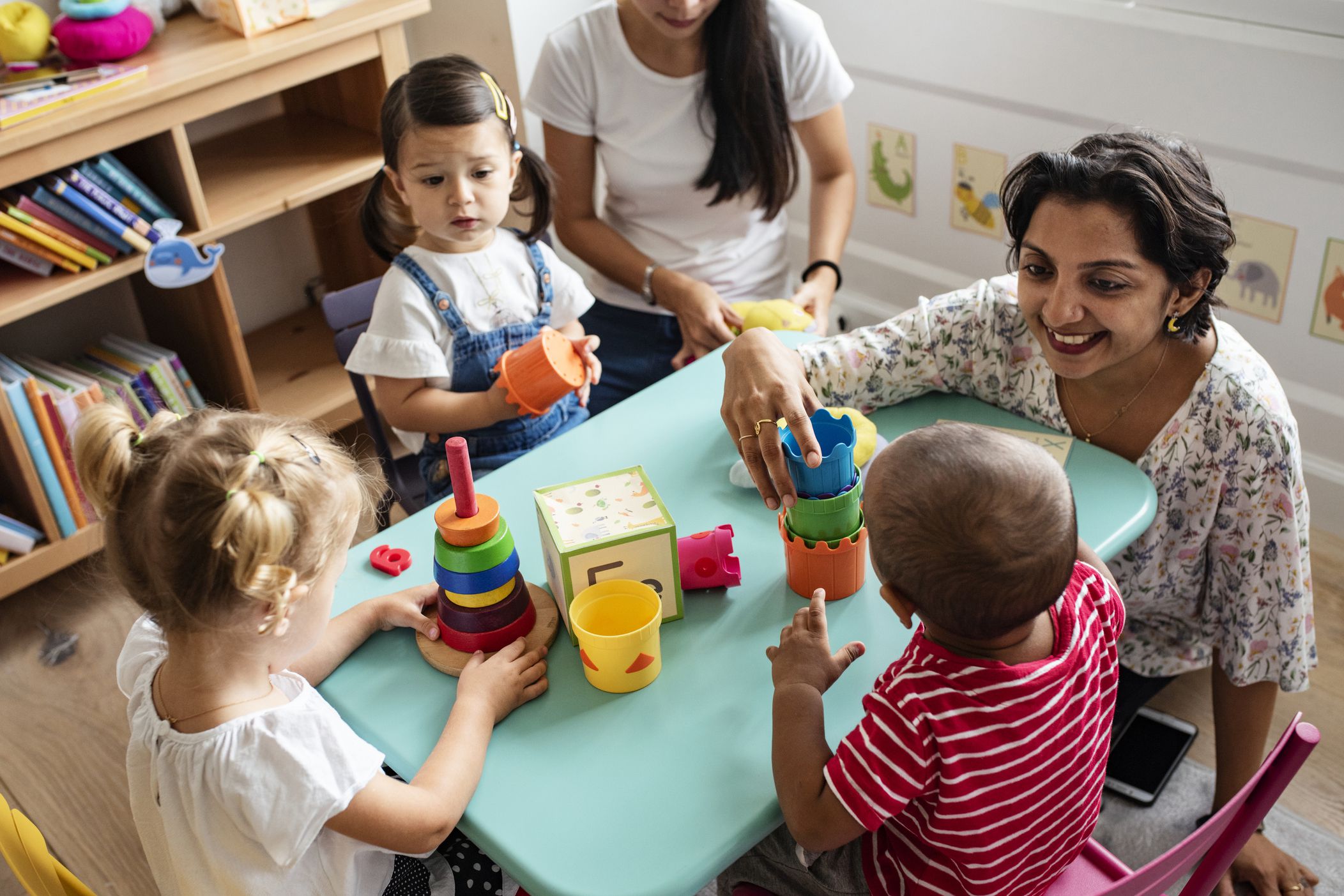 woman volunteering playing games with children