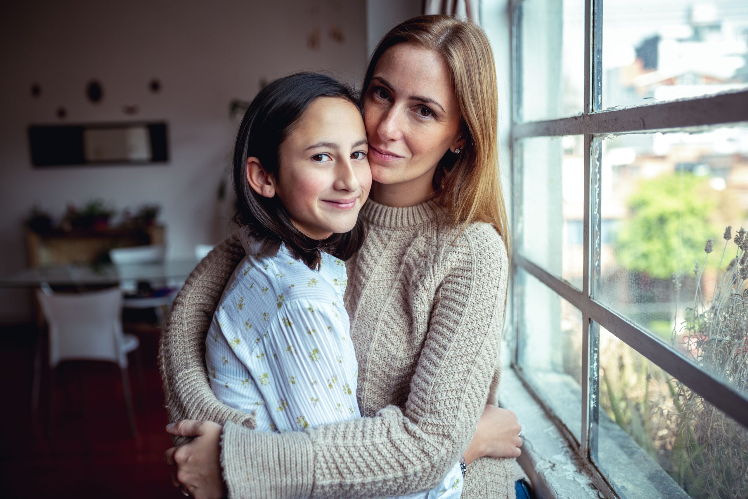 mother and daughter hugging